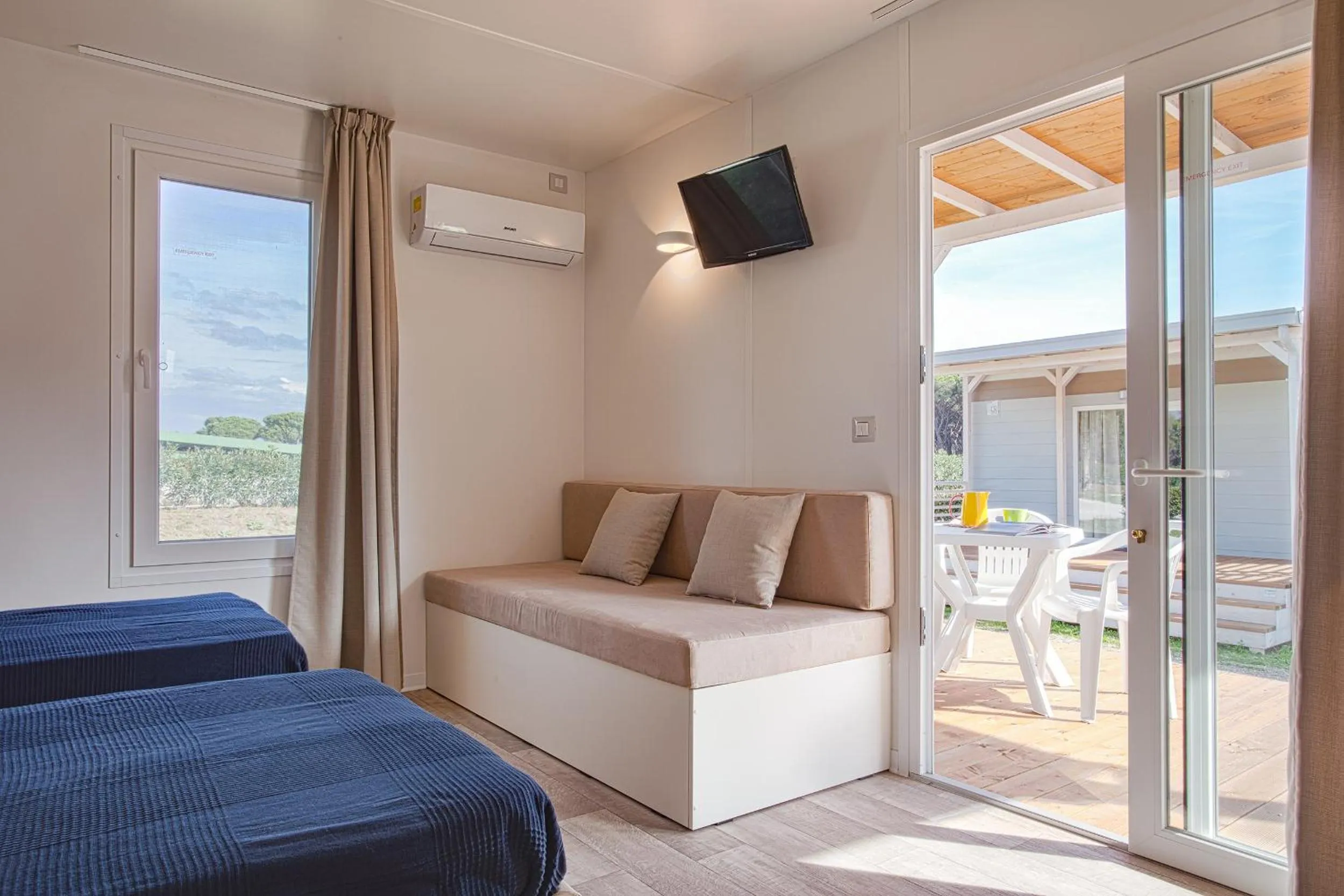 Seating area, Bed in Camping Village Roma Capitol