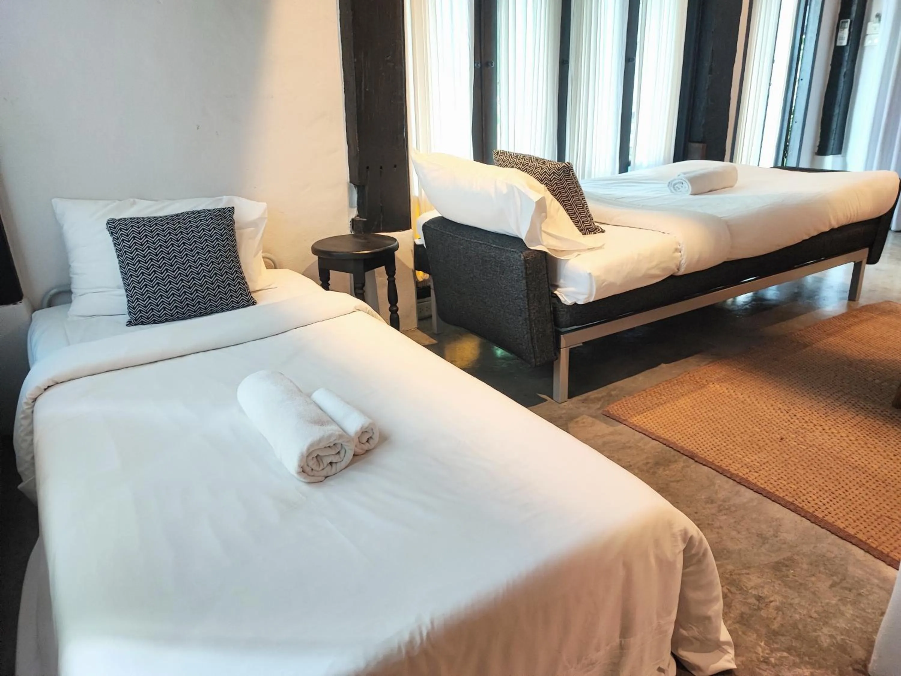 Bed in Chotana Villa Hotel Chiang Mai