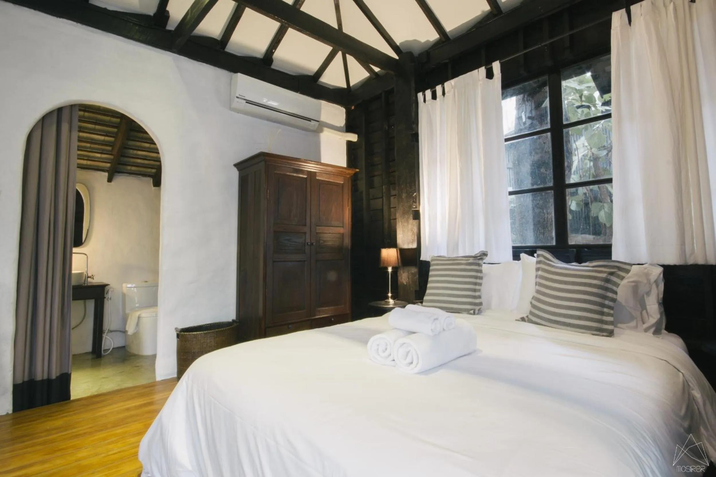 Photo of the whole room, Bed in Chotana Villa Hotel Chiang Mai