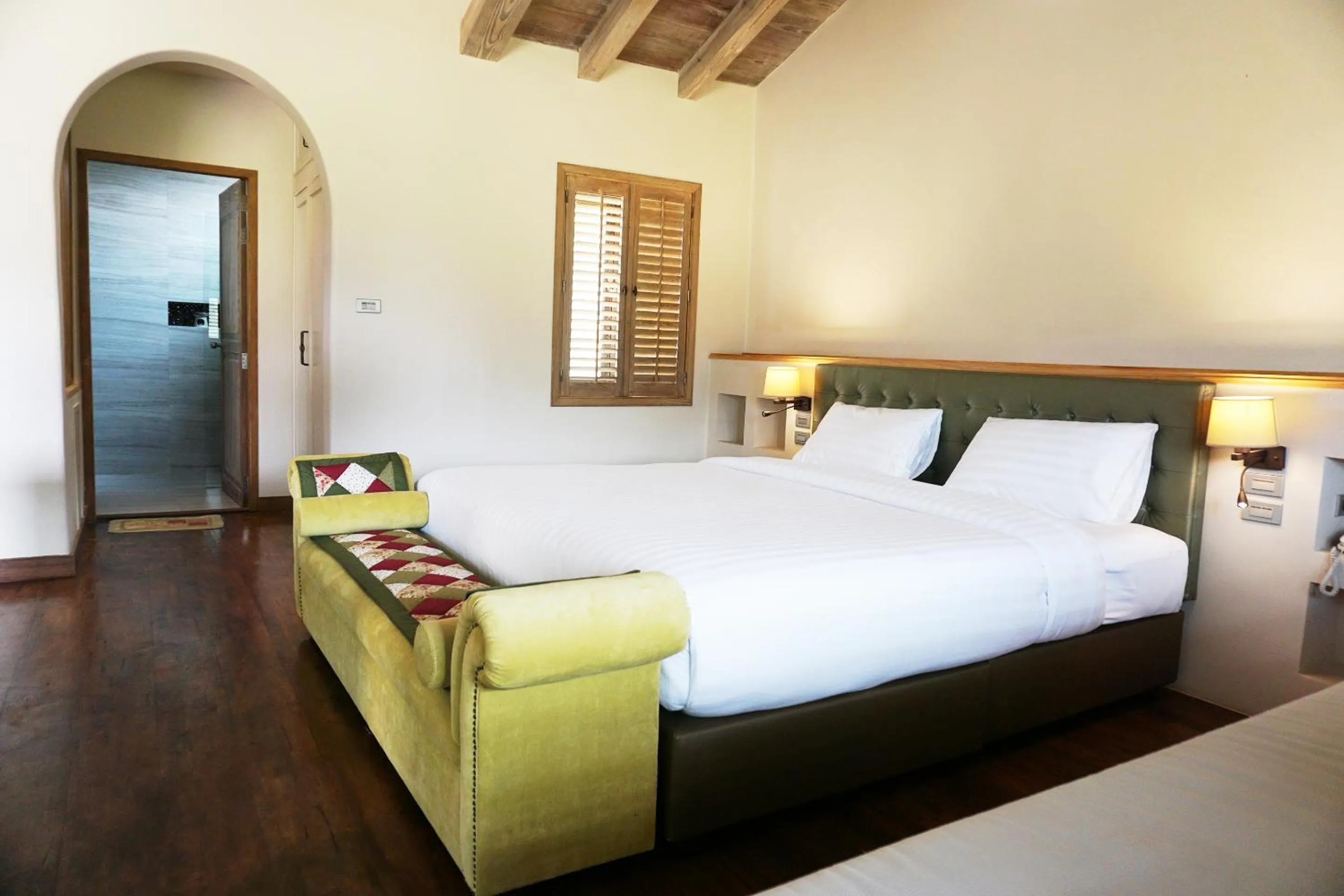 Bed in Mela Garden Retreat Cottage