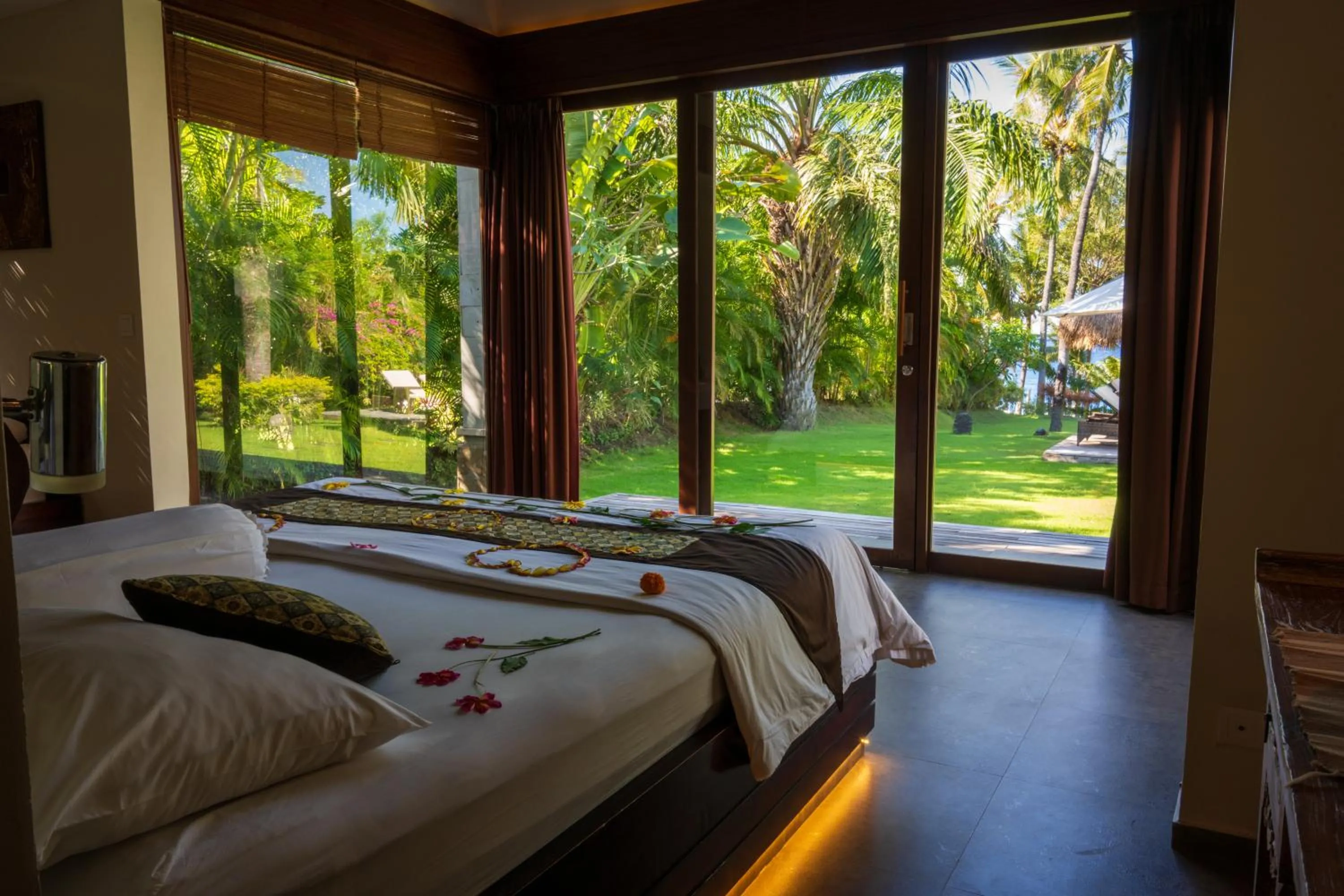 Bed in Relax Bali Dive & SPA ocean front resort