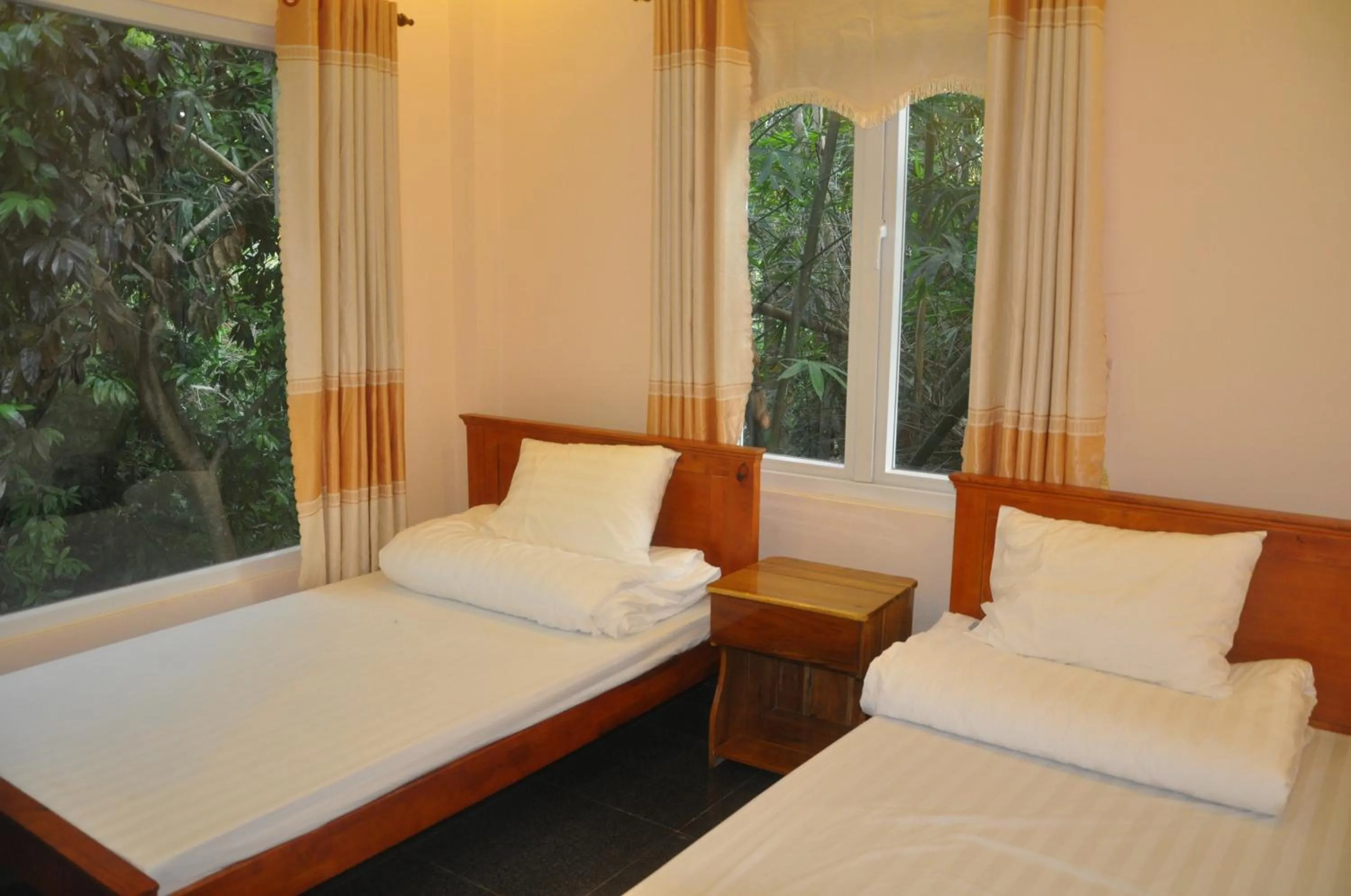 Bed in Sun & Wind Paradise Bungalow