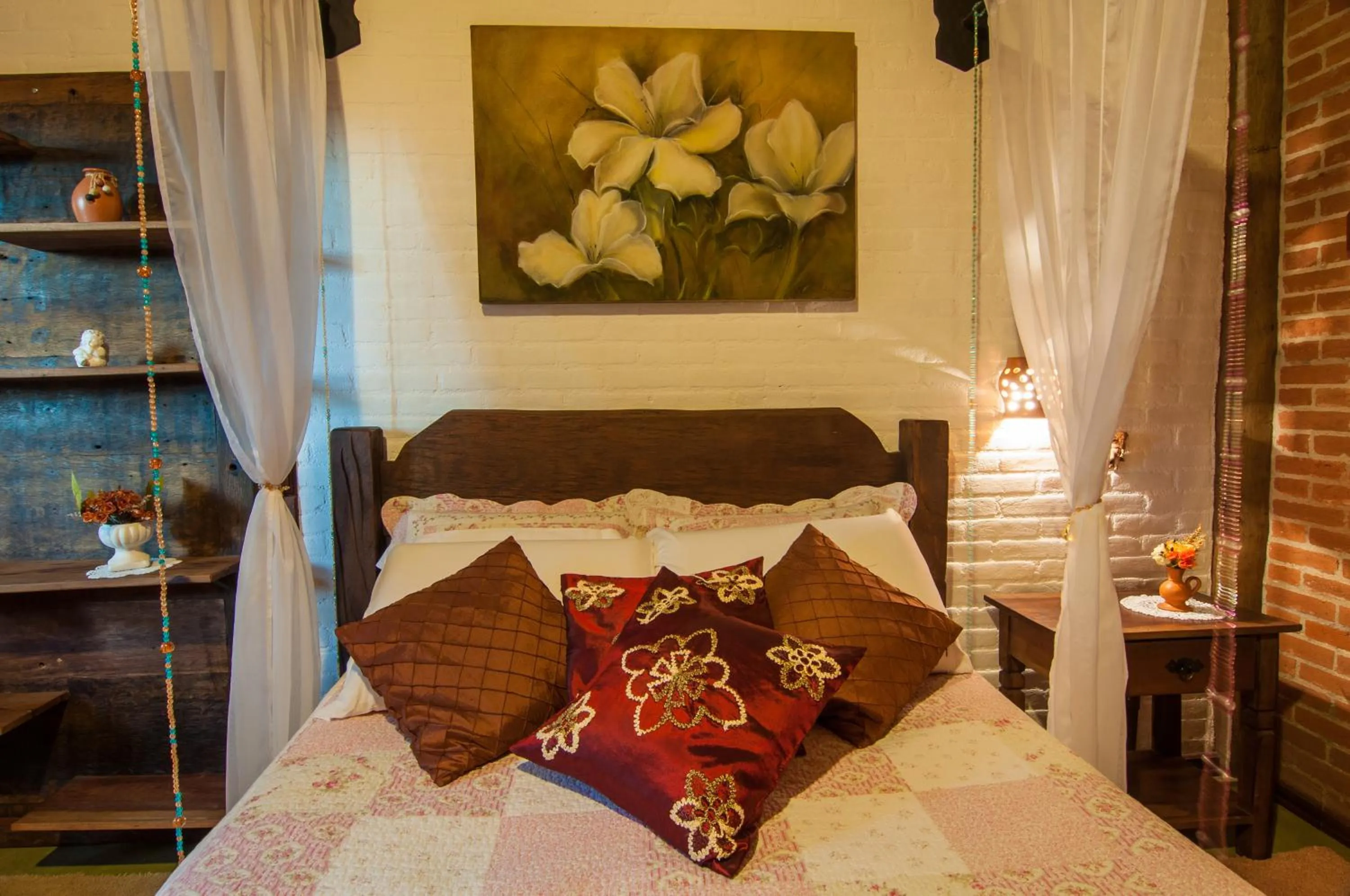 Bed in Pousada Alto da Neblina