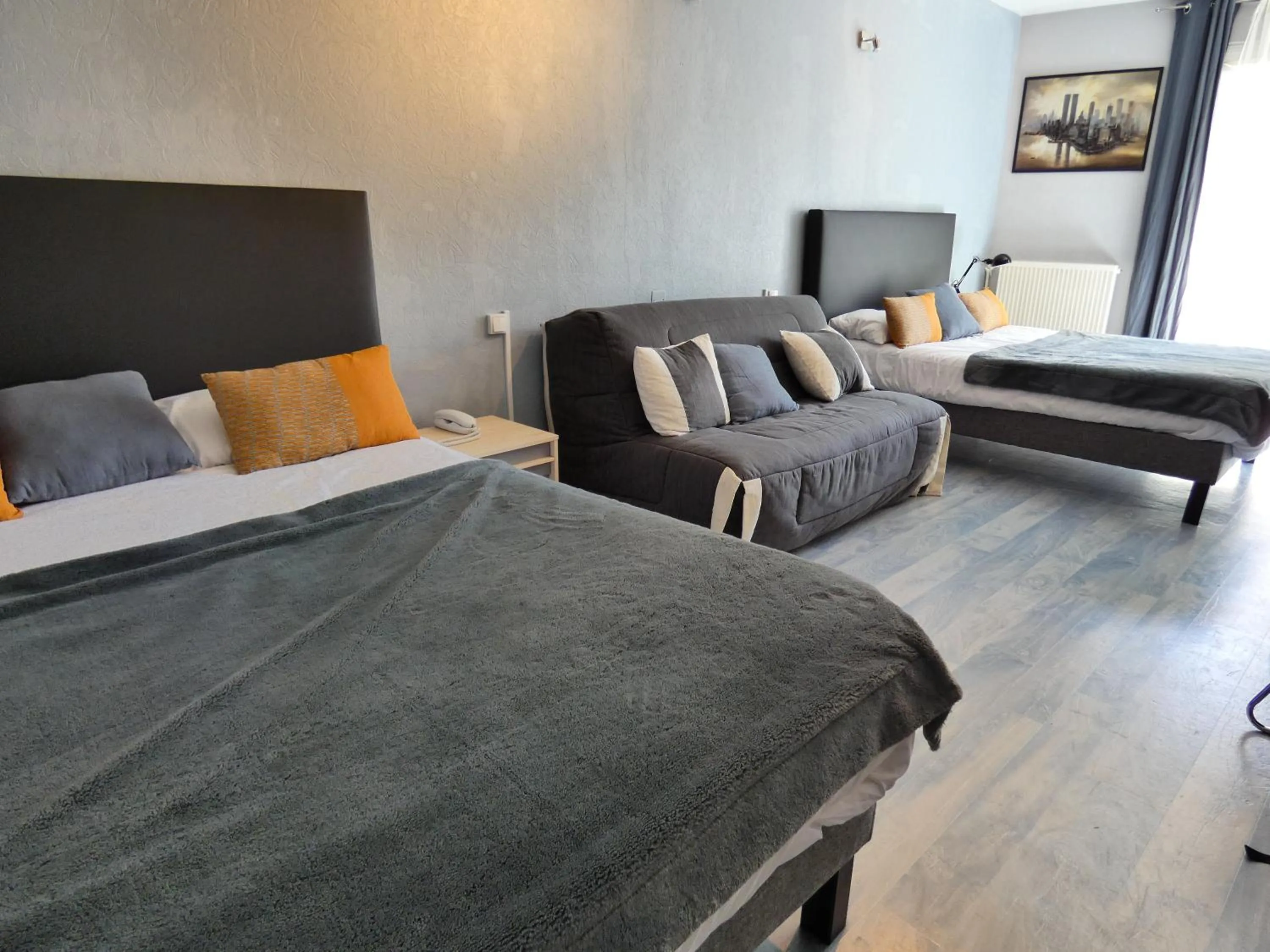 Bed in Logis Hôtel Emeraude