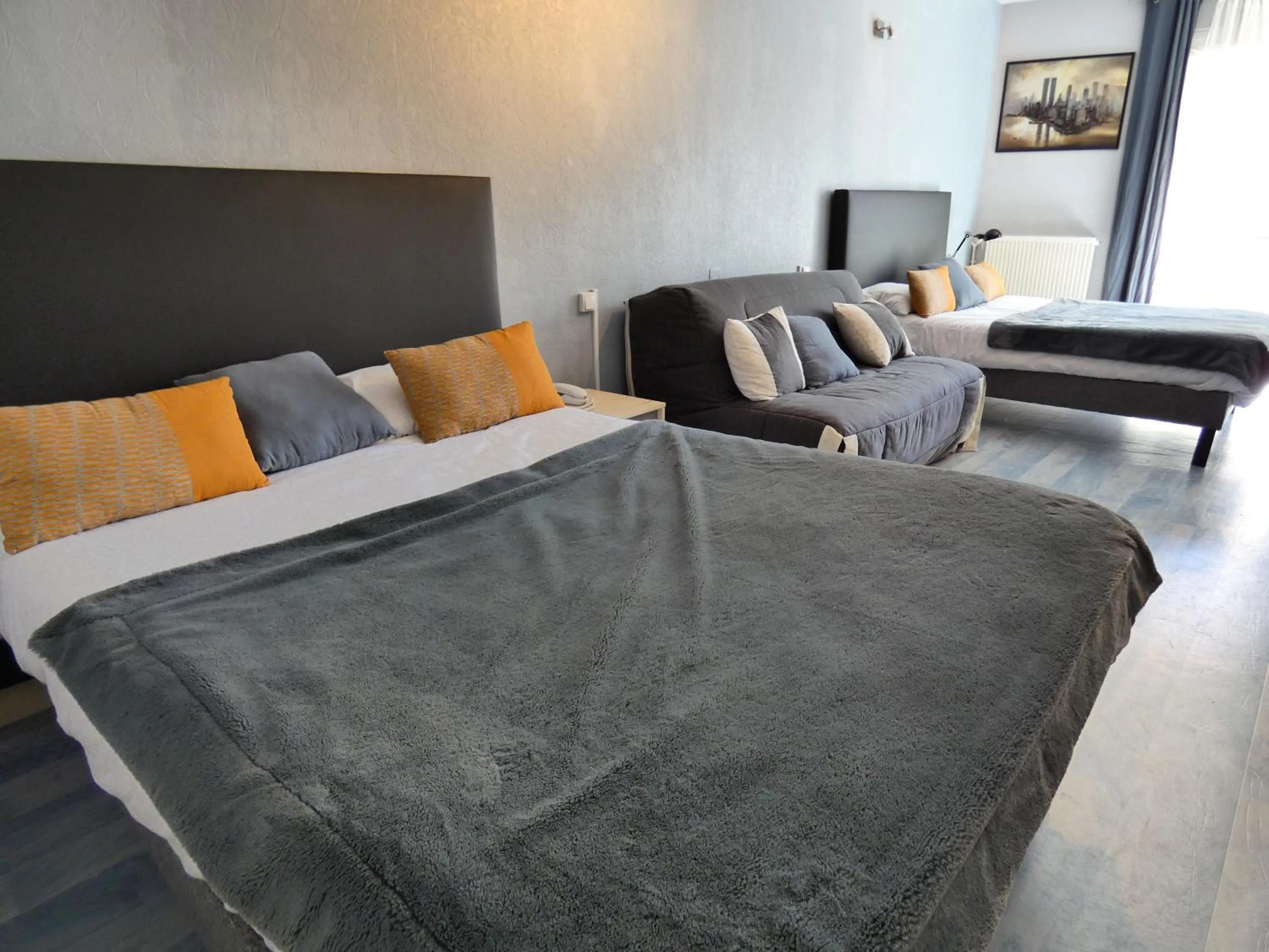 Bed in Logis Hôtel Emeraude