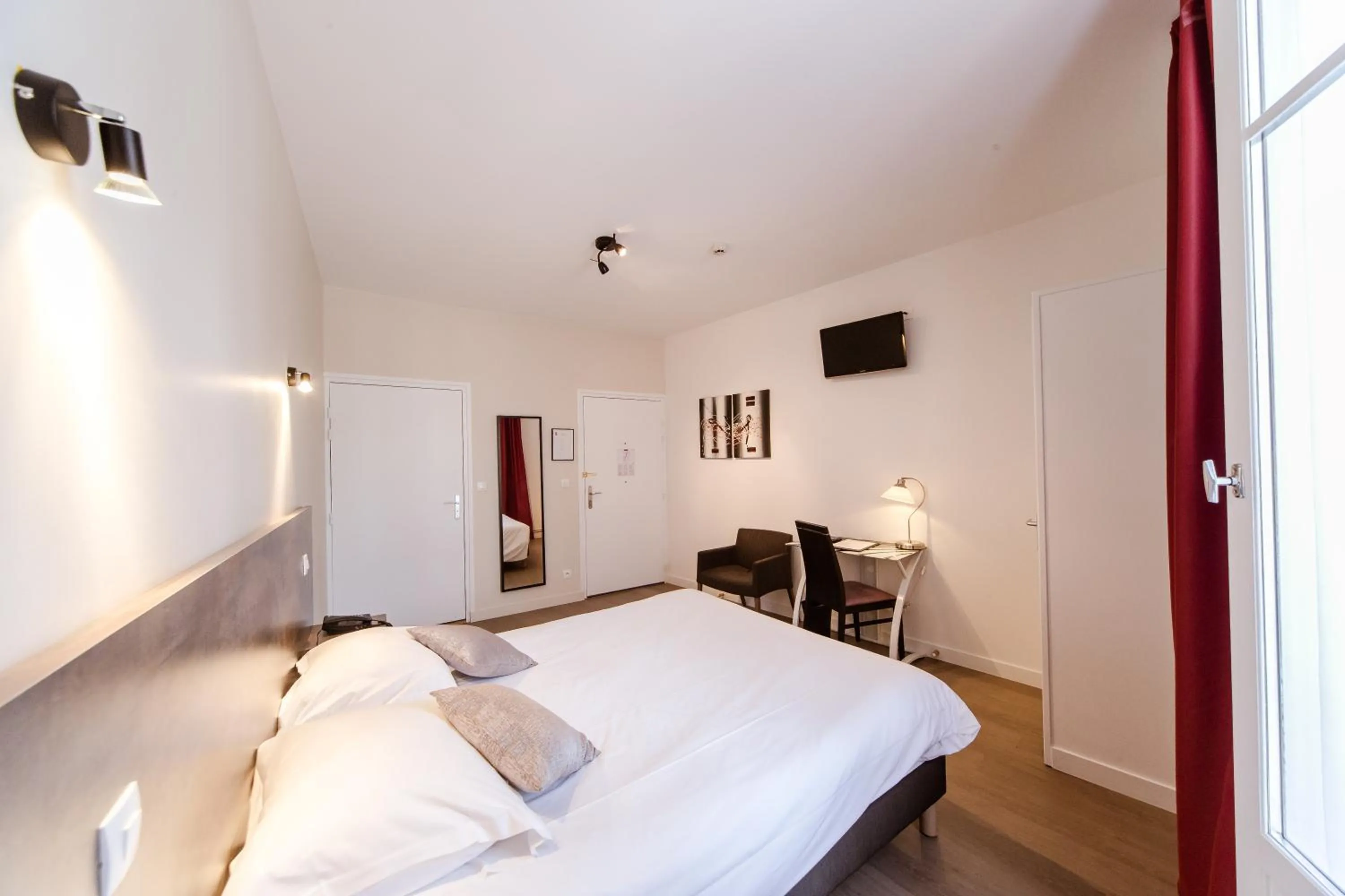 Photo of the whole room, Bed in LOGIS HOTEL - Le Petit Bellon