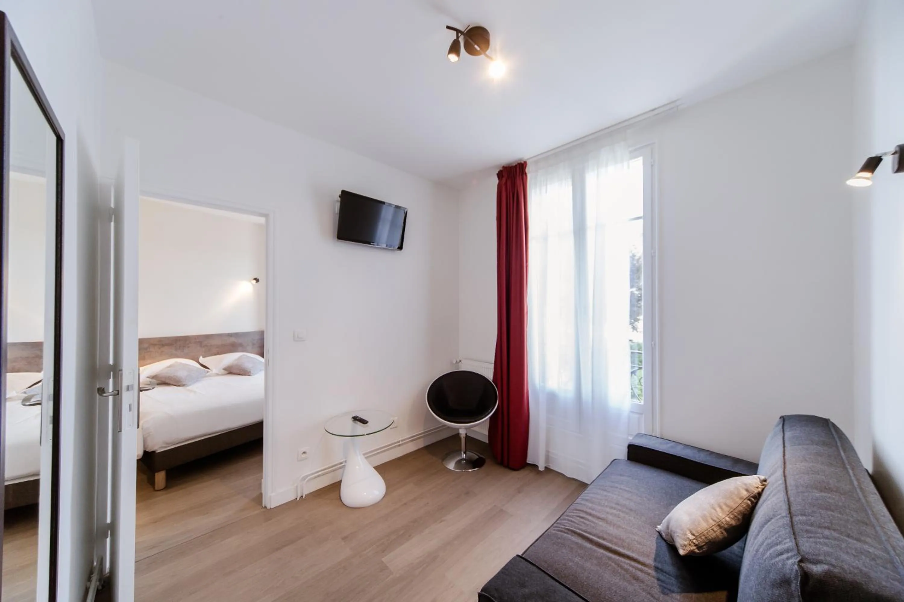 Seating area, Bed in LOGIS HOTEL - Le Petit Bellon