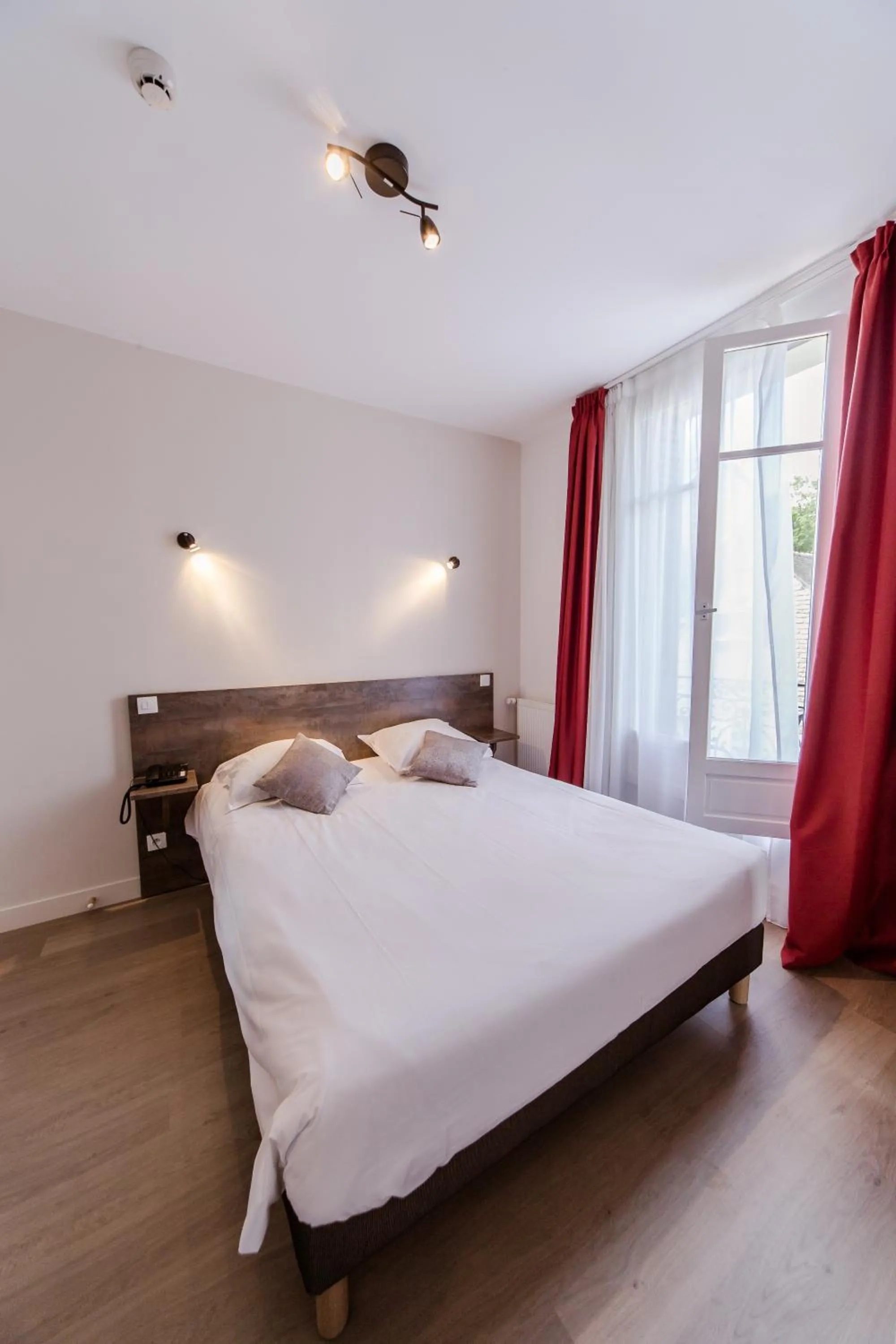 Bed in LOGIS HOTEL - Le Petit Bellon