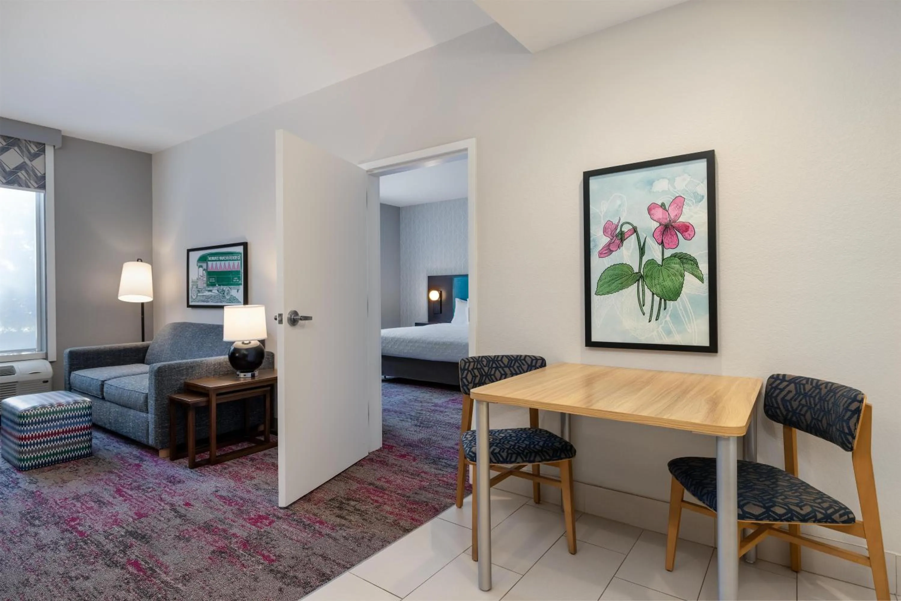 Living room, Bed in Home2 Suites by Hilton Milwaukee Brookfield