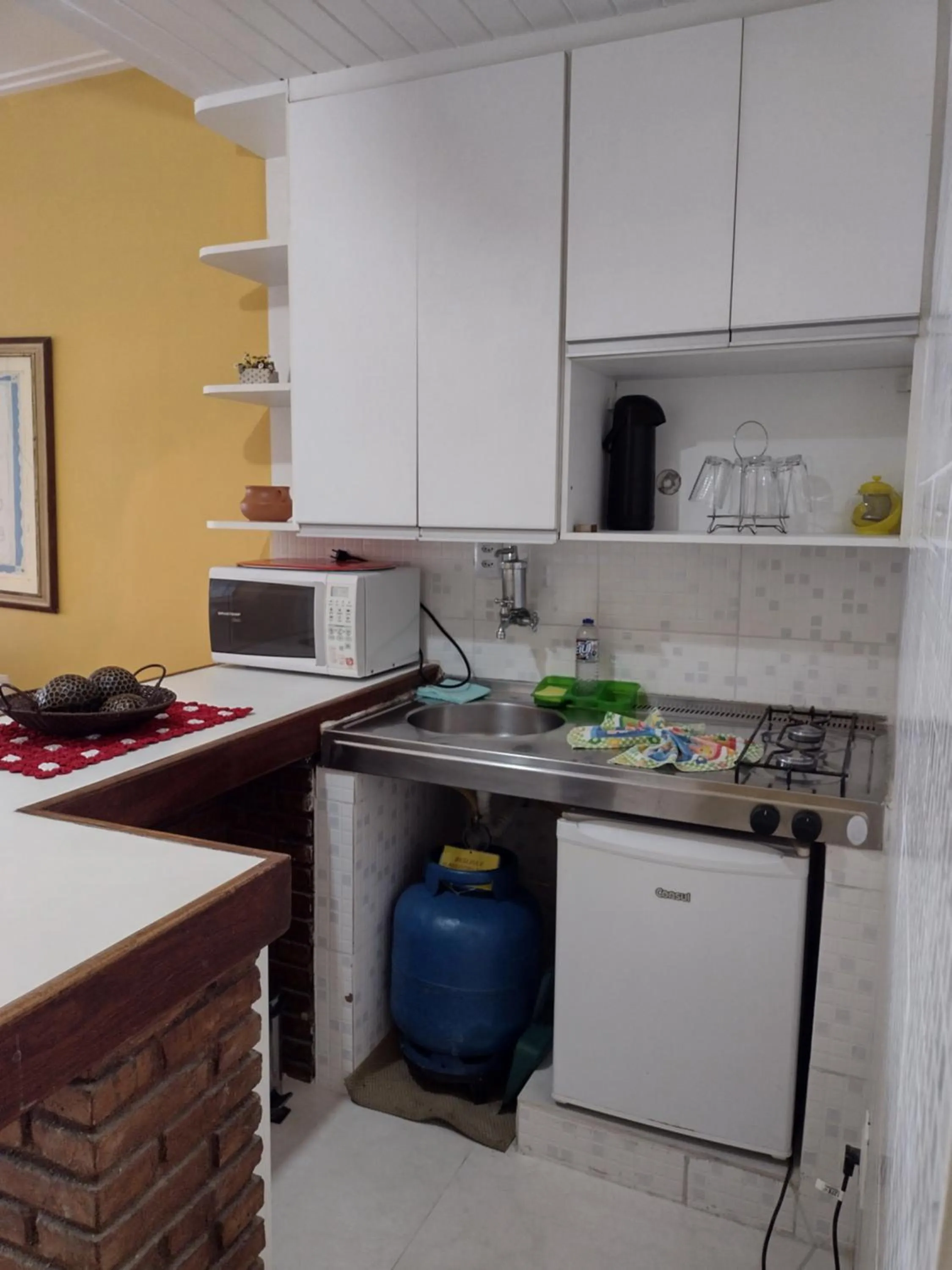 Kitchen or kitchenette in Farol Barra Flat 202