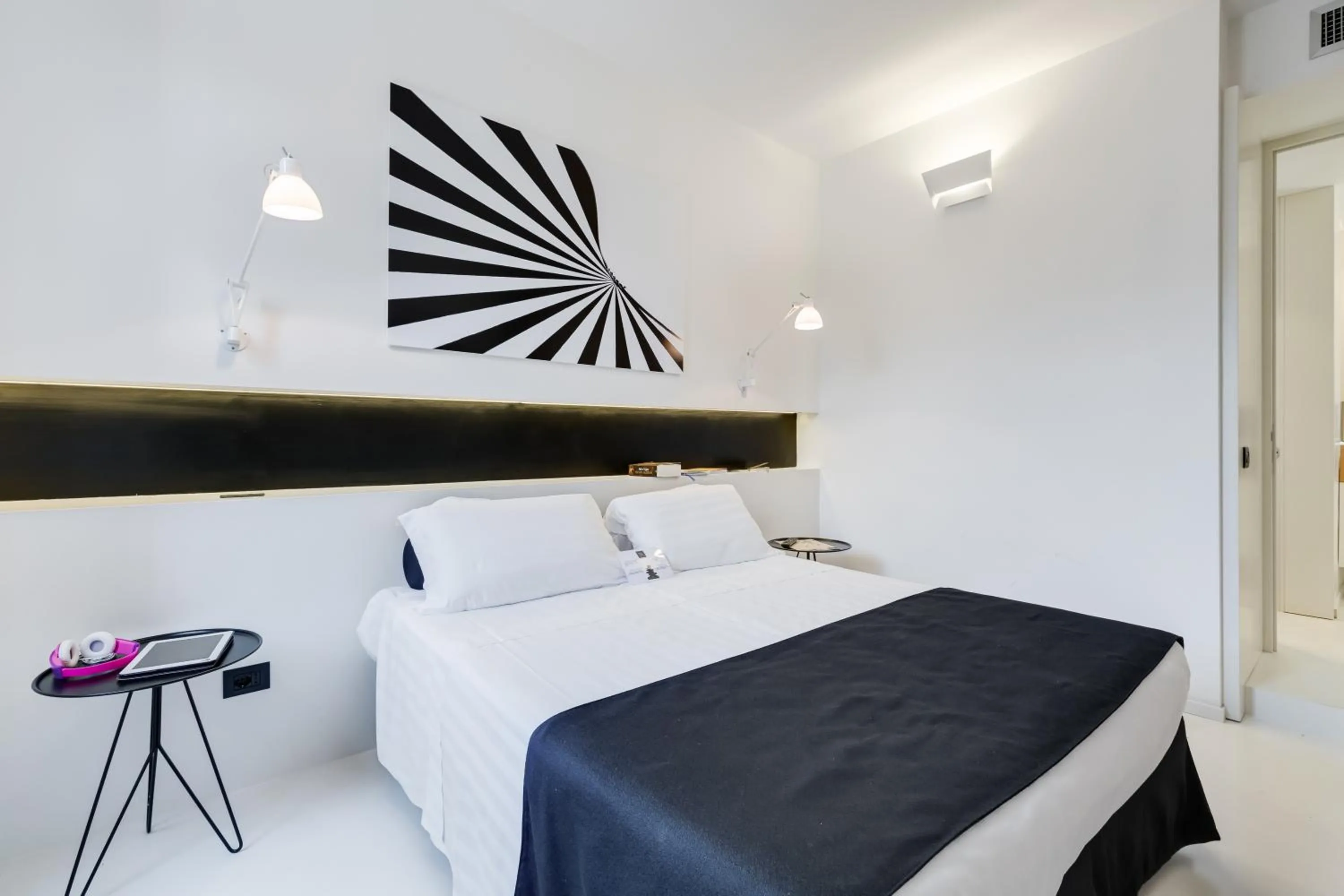 Bed in Sora Luxury Inn