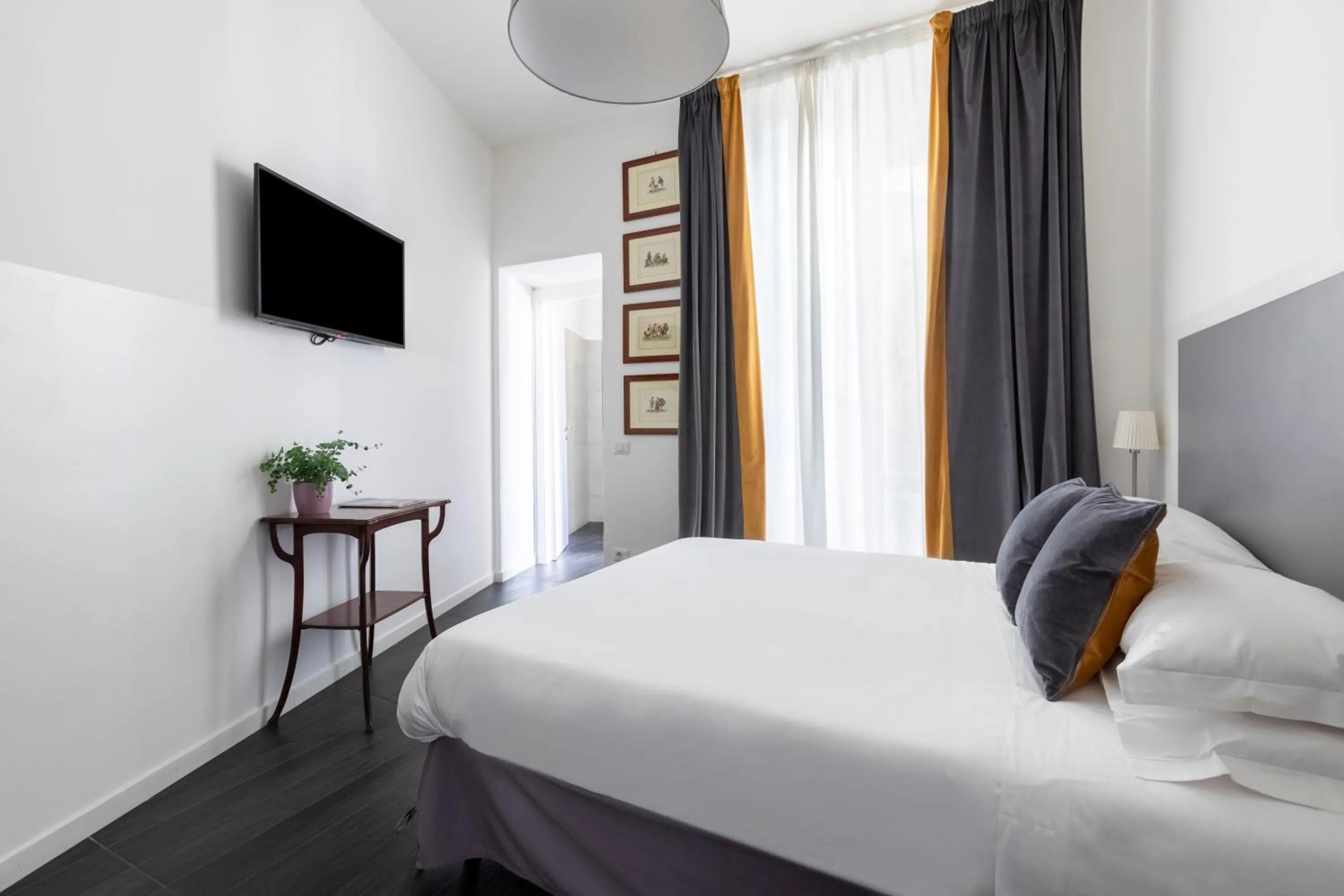 Photo of the whole room, Bed in Vatican City Suites by Hili