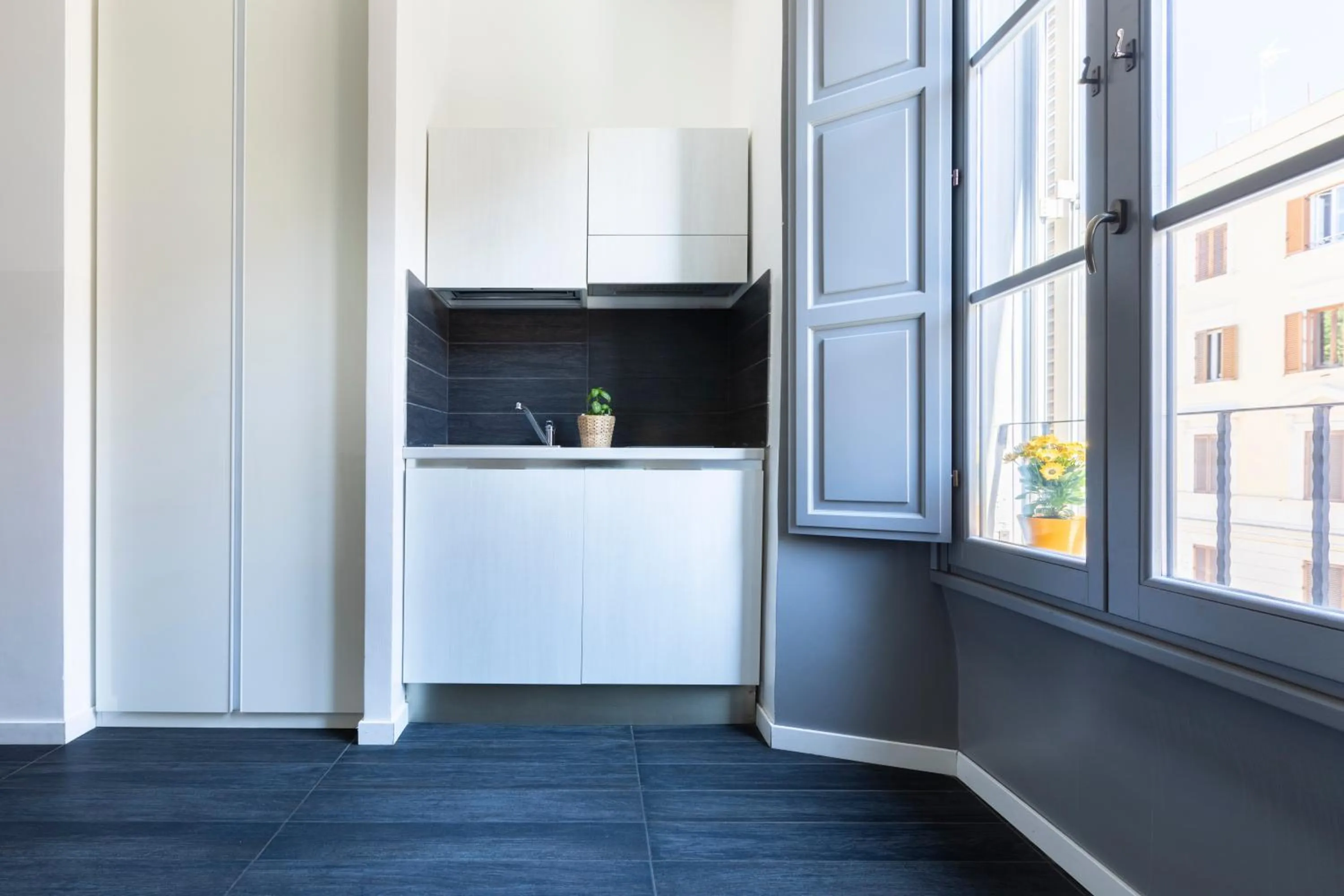 Kitchen or kitchenette in Vatican City Suites by Hili