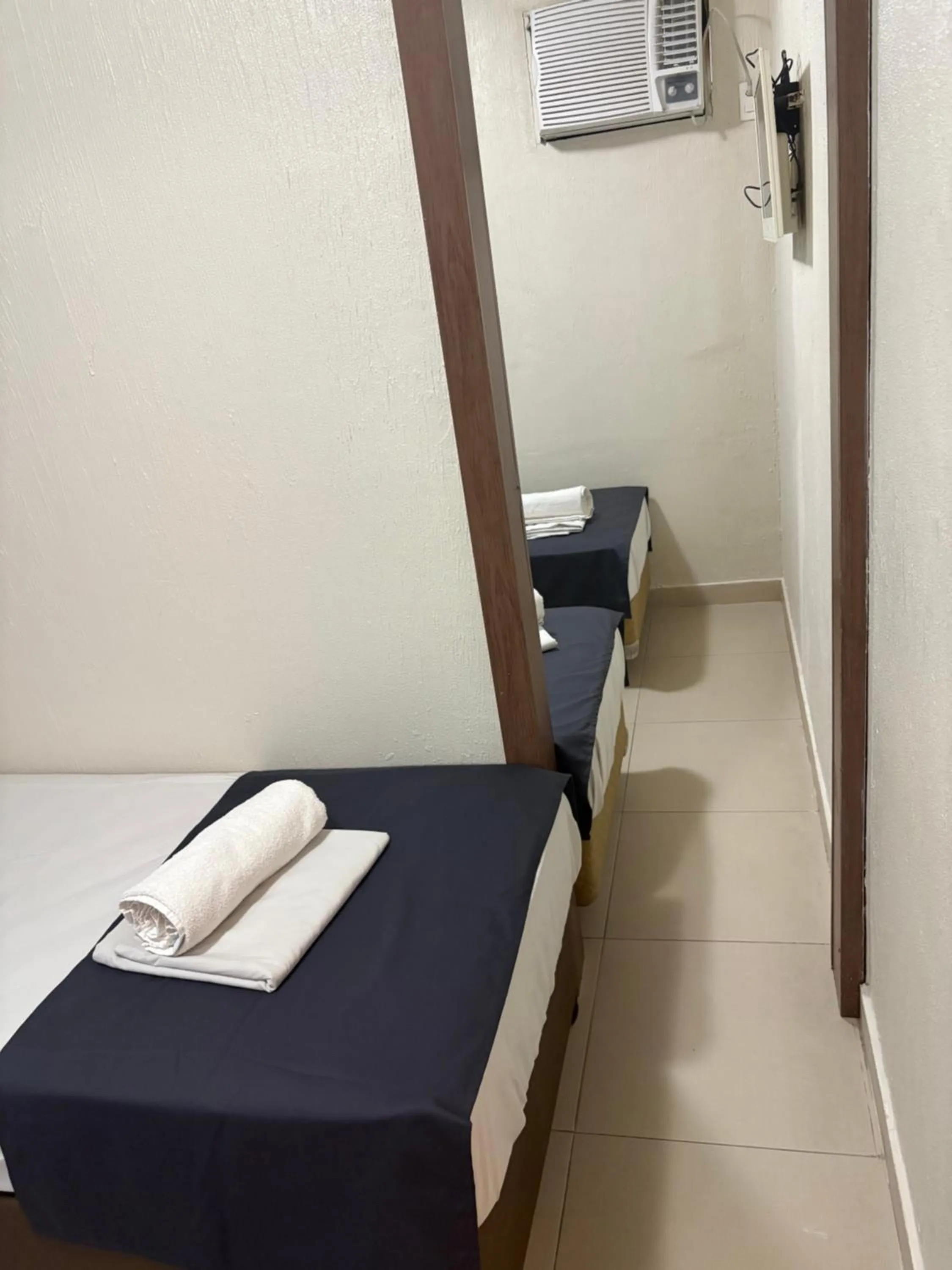 Photo of the whole room, Bed in Downtown Santana Hotel