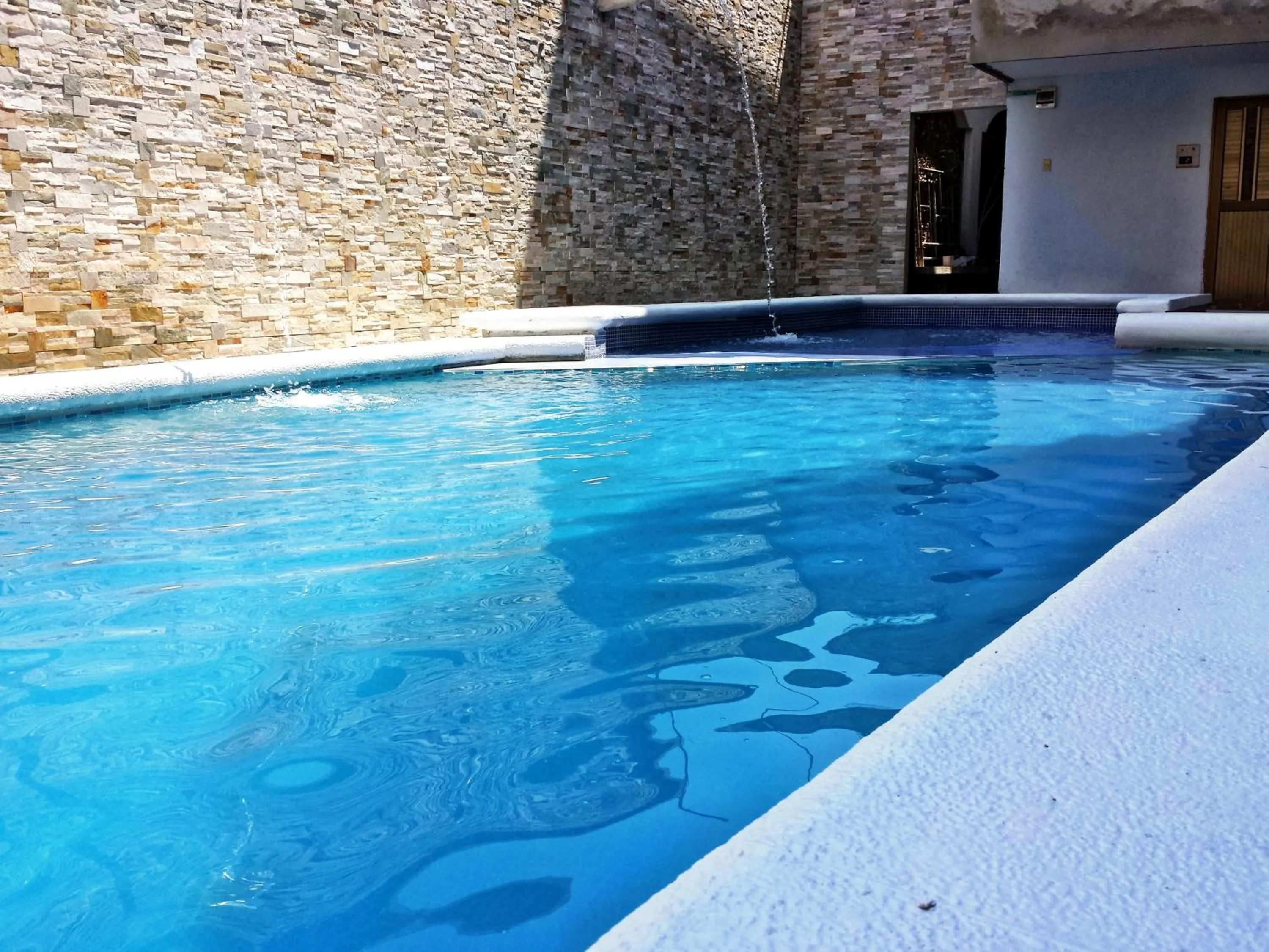 Swimming pool in Hotel Dorado BAQ