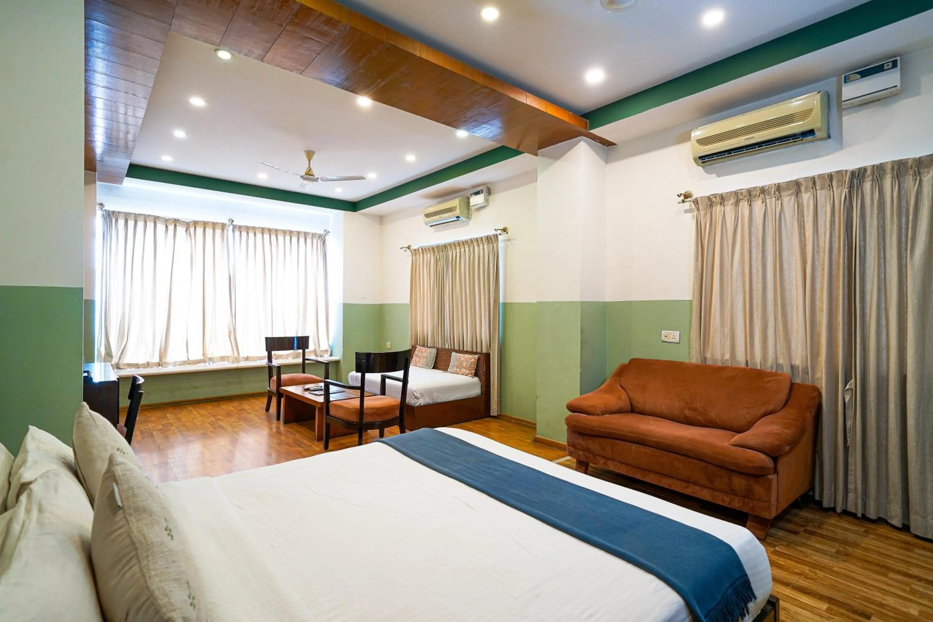 Living room, Bed in Olive Zip Rest House Road by Embassy Group