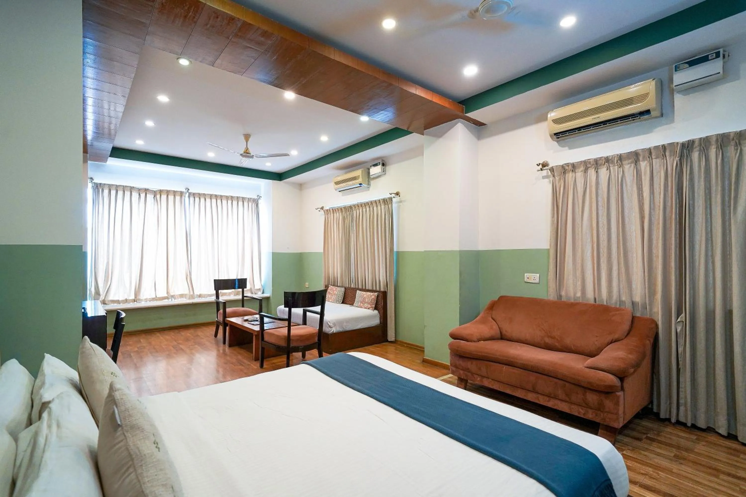 Living room, Bed in Olive Zip Rest House Road by Embassy Group