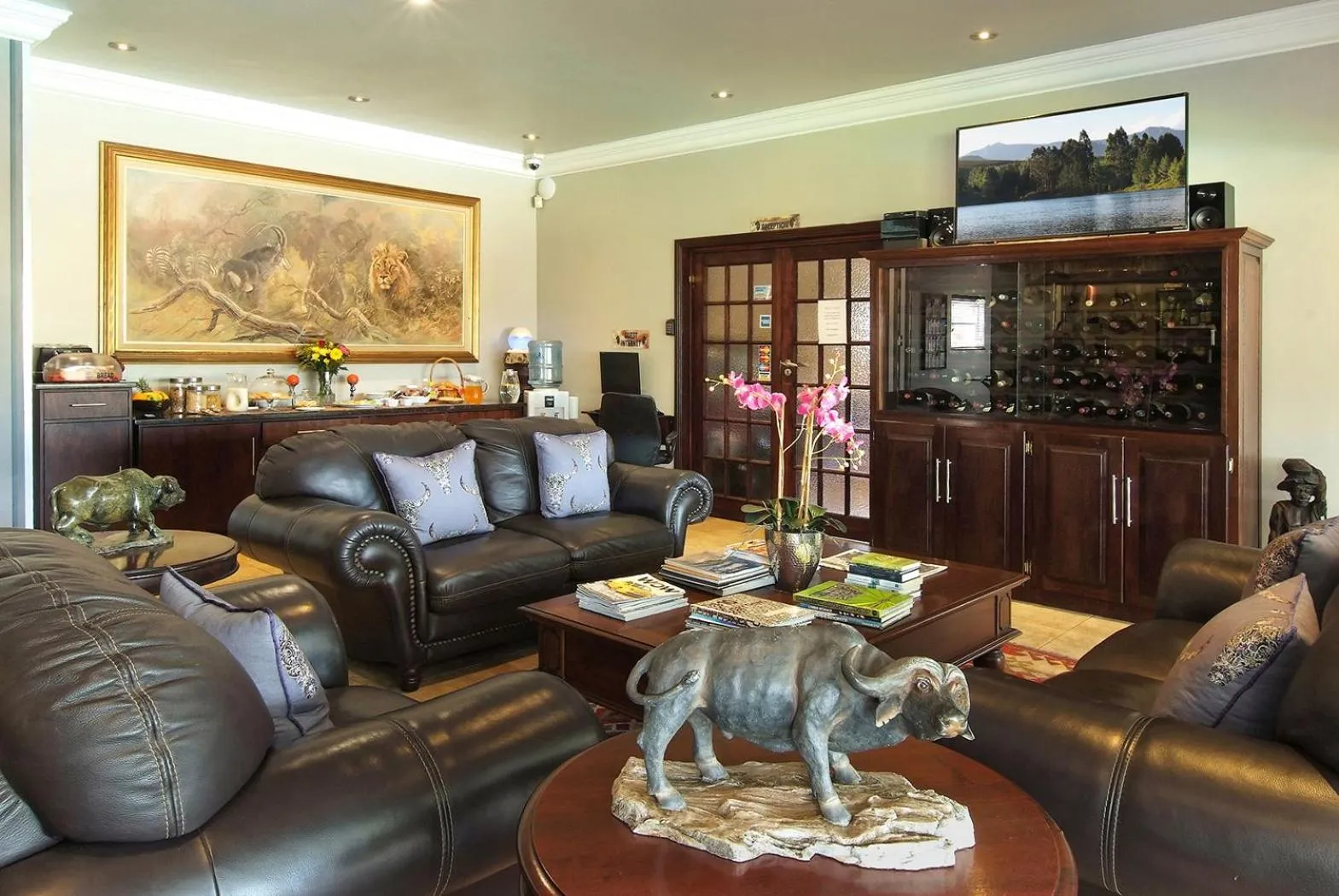 Communal lounge/ TV room in uShaka Manor Guest House