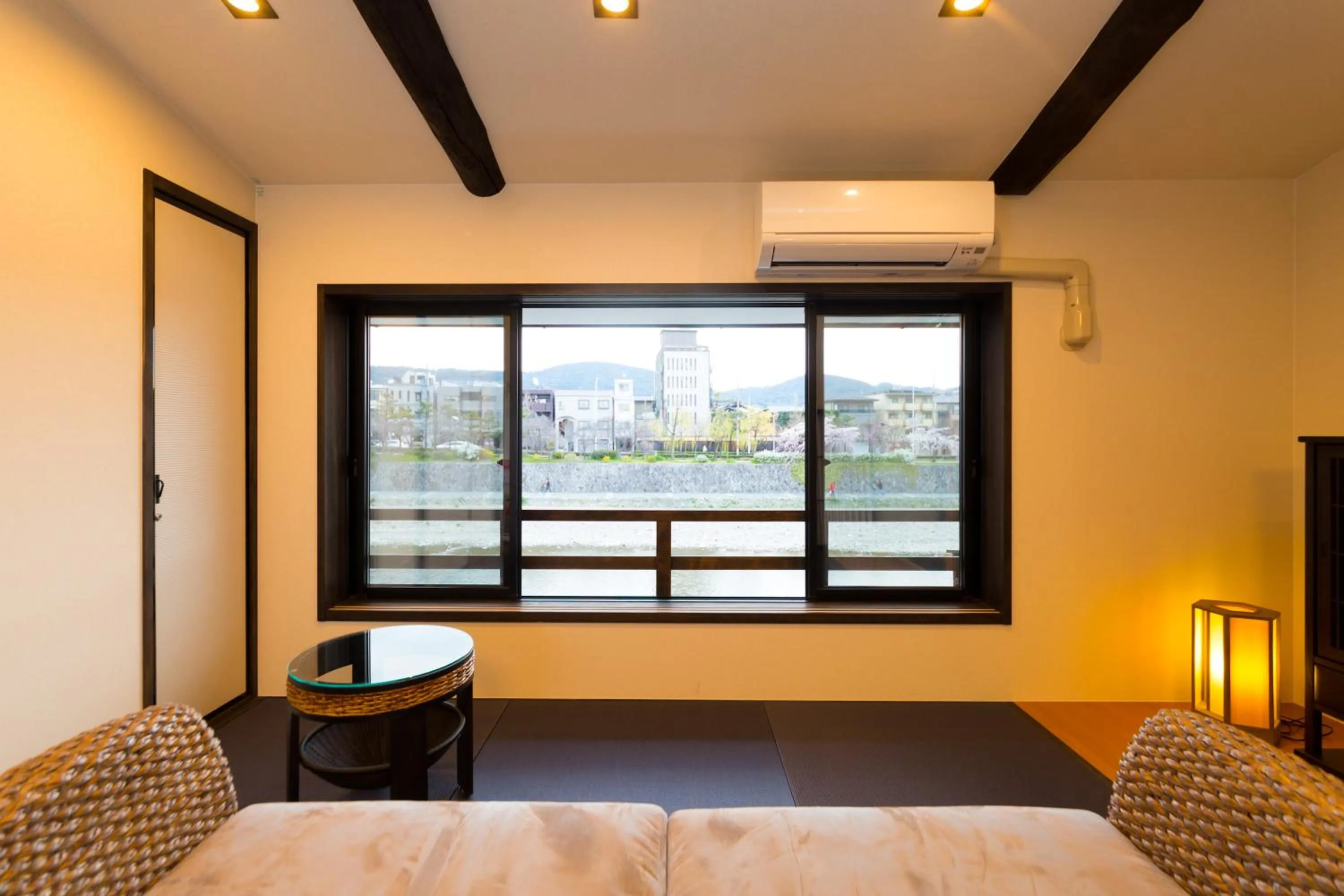 Living room, Bed in 京と家 鴨川五条 -Kyotoya Kamogawagojo-