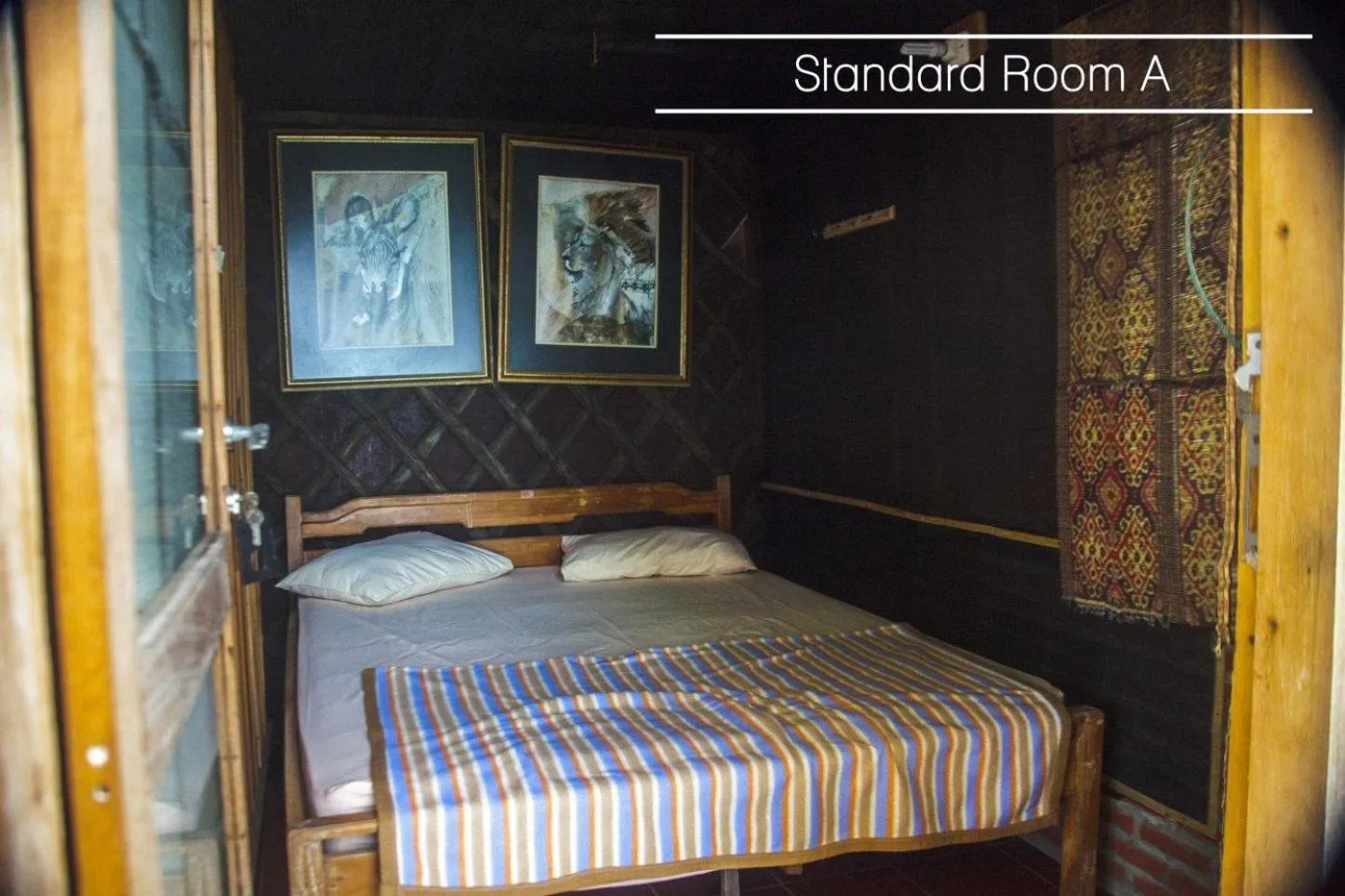 Bed in Karang Aji Beach Villa