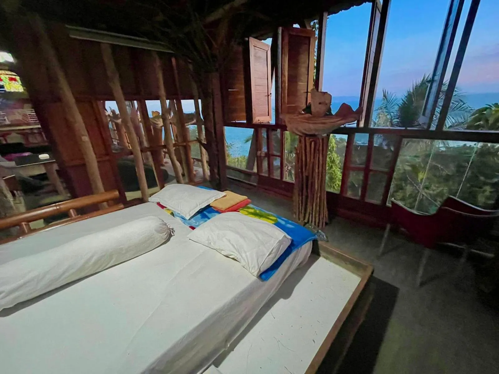 Bed in Karang Aji Beach Villa