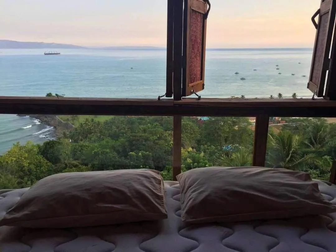 Bed in Karang Aji Beach Villa