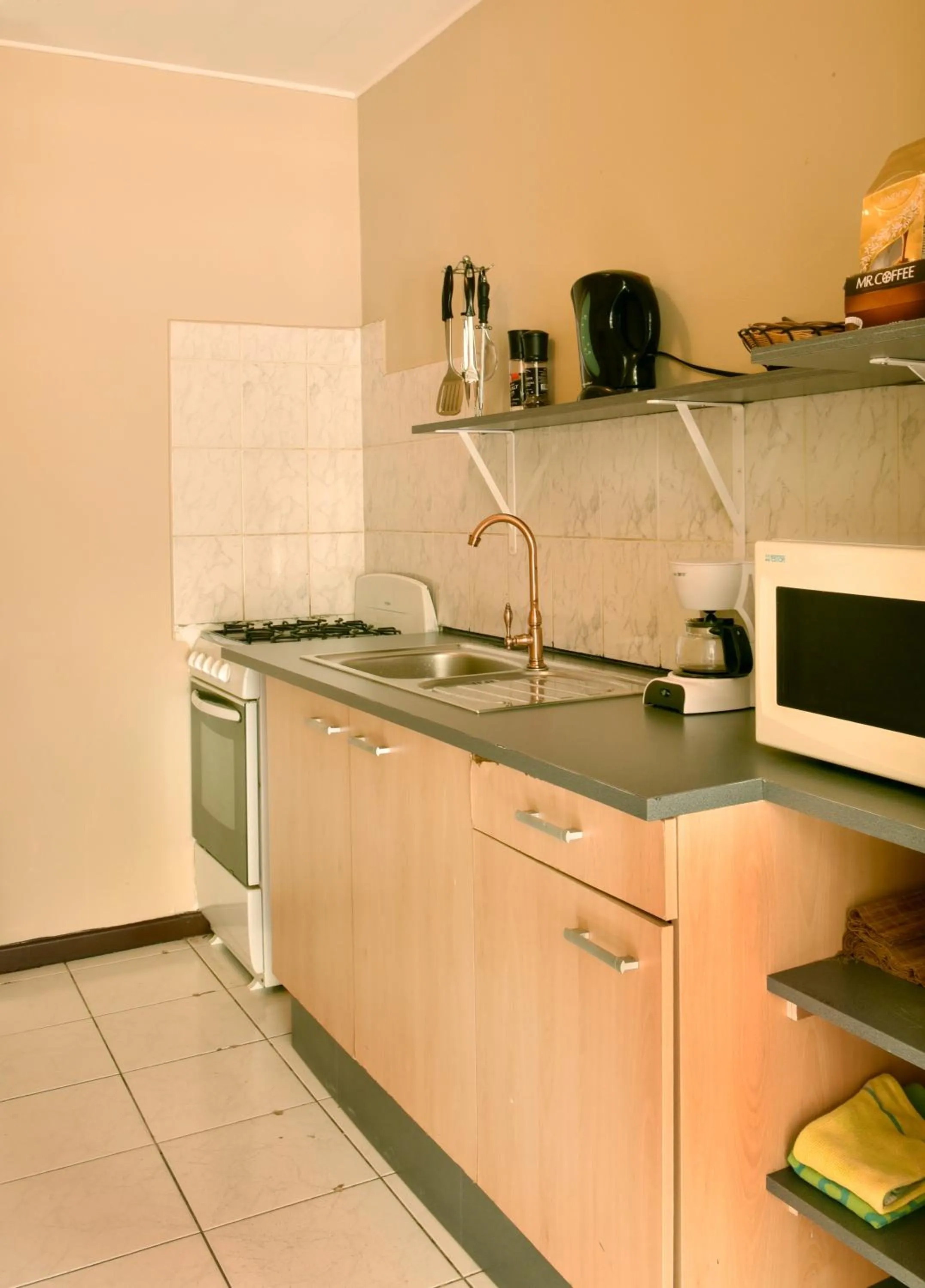 Kitchen or kitchenette in Pega Pega Apartments