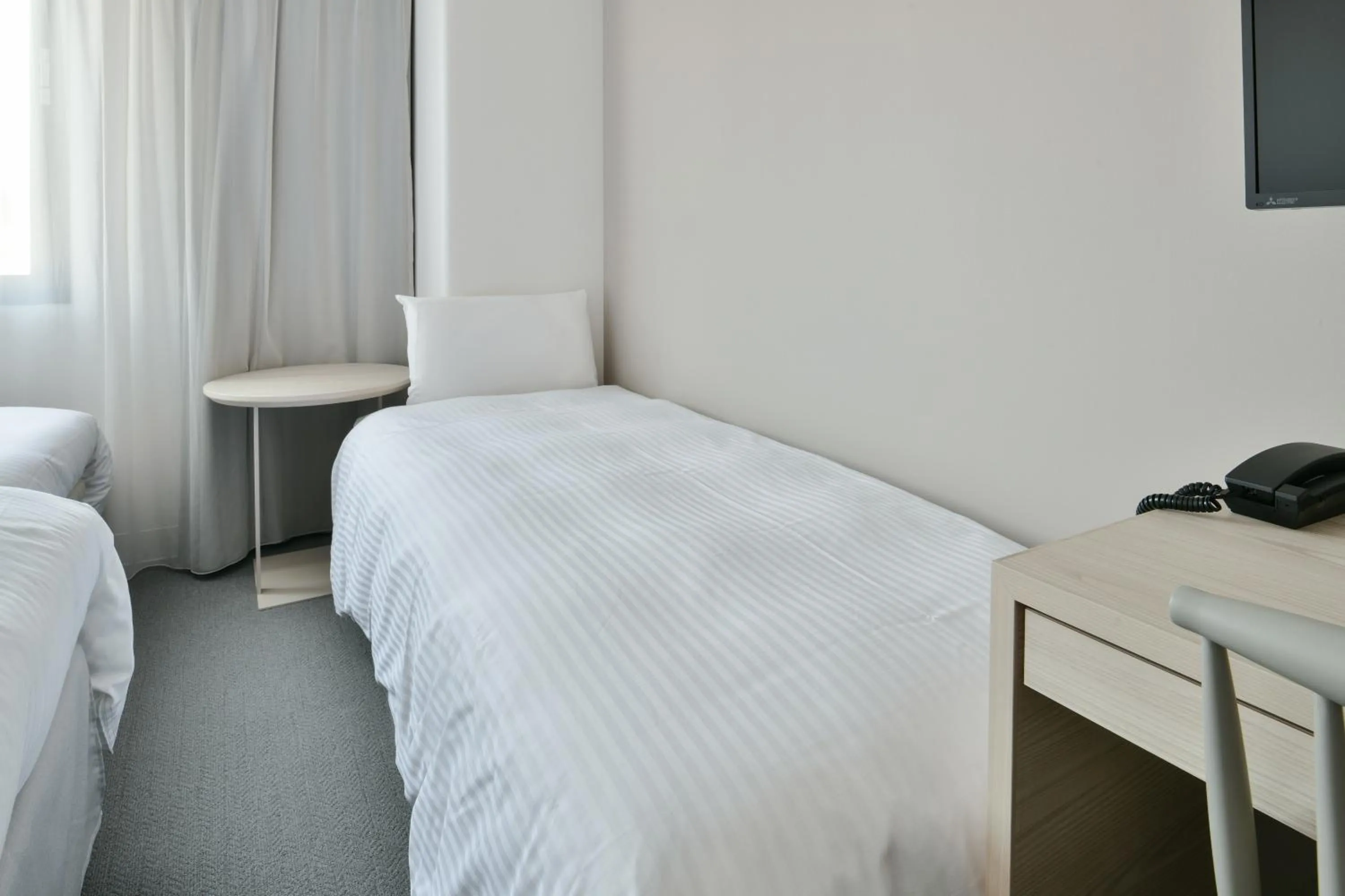 Bed in Vessel Hotel Fukuyama