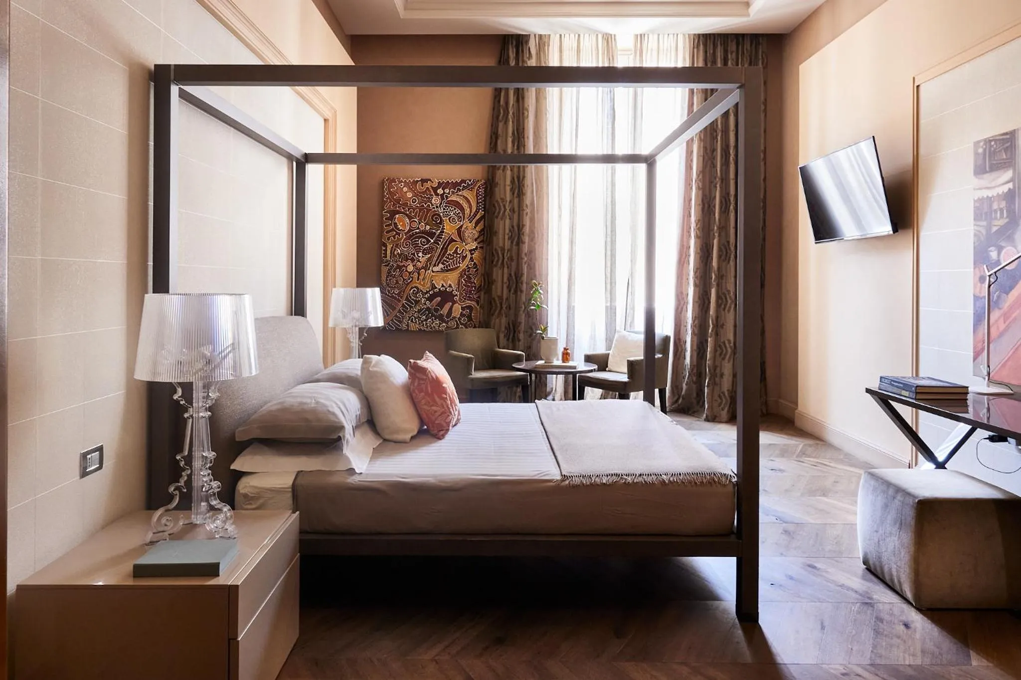 Bed in Le Quattro Dame Luxury Suites