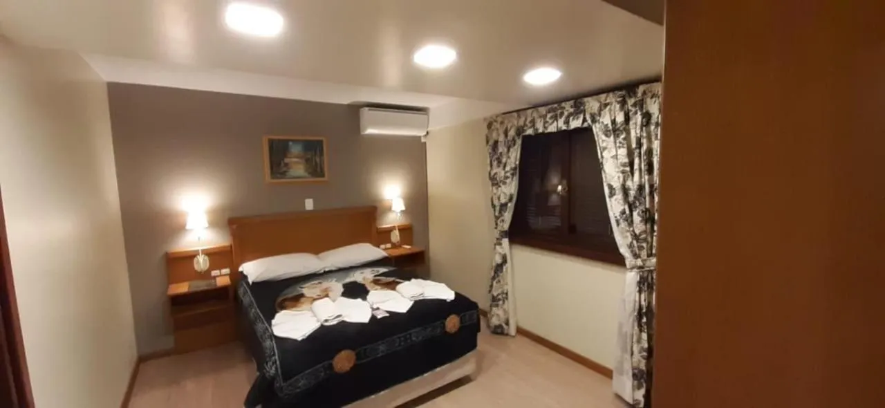 Bed in Pousada Das Papoulas