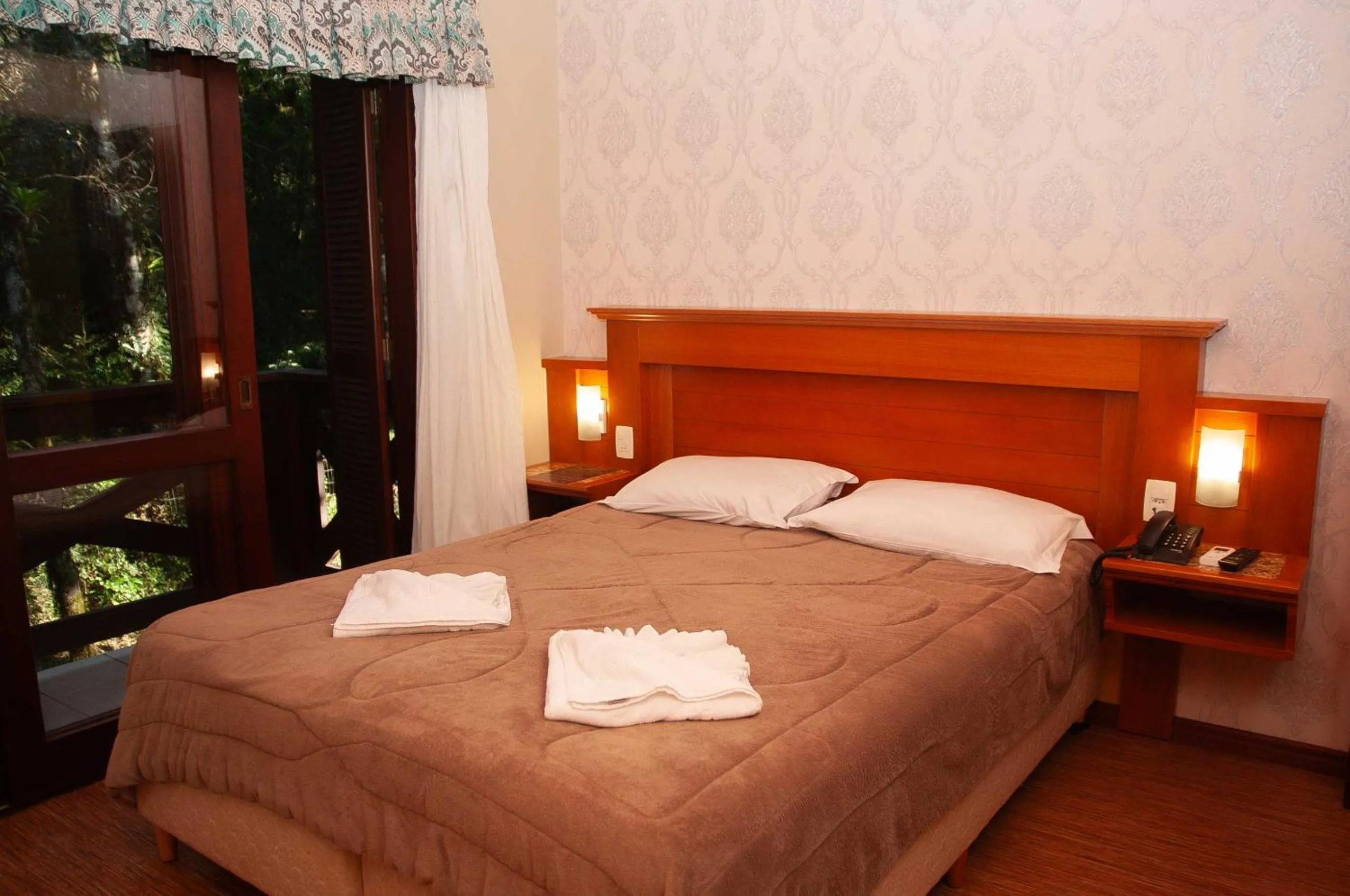 Bed in Pousada Das Papoulas