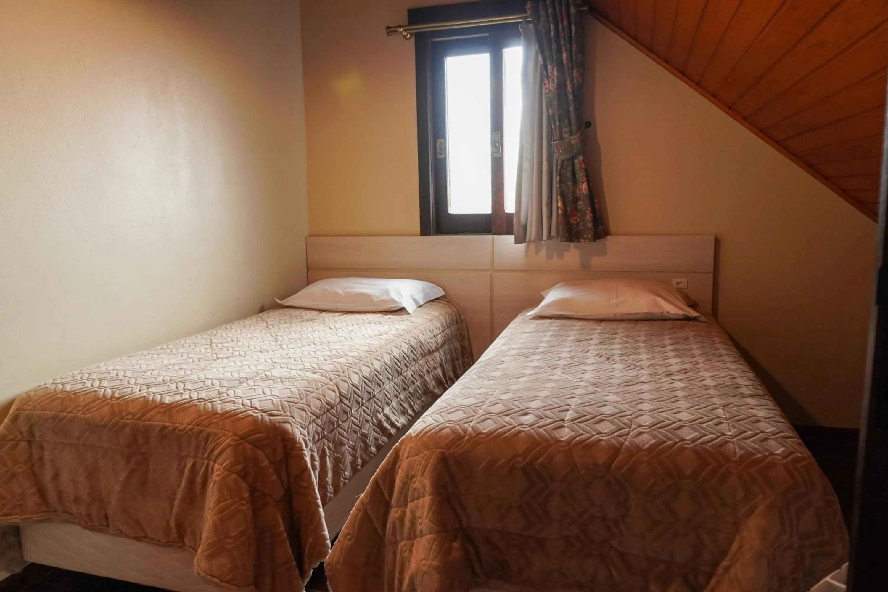 Bed in Pousada Das Papoulas