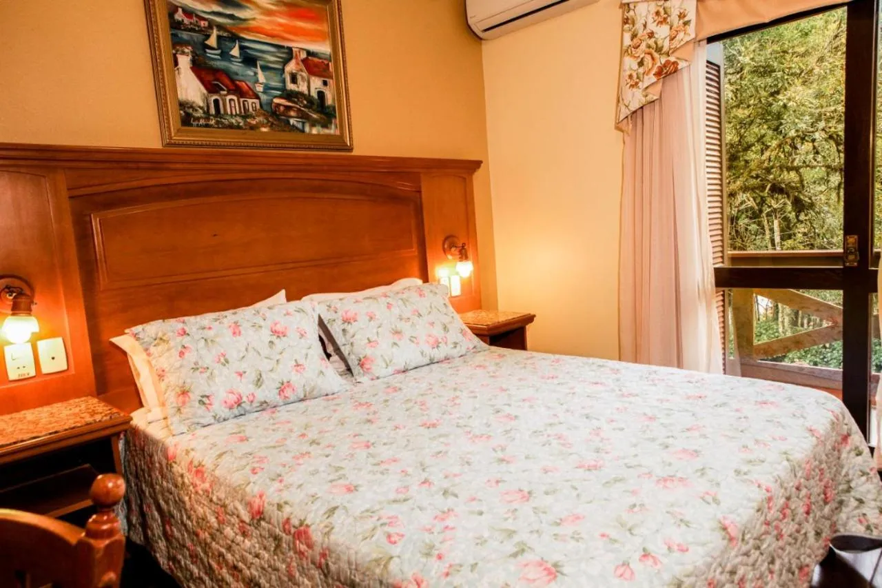 Bed in Pousada Das Papoulas