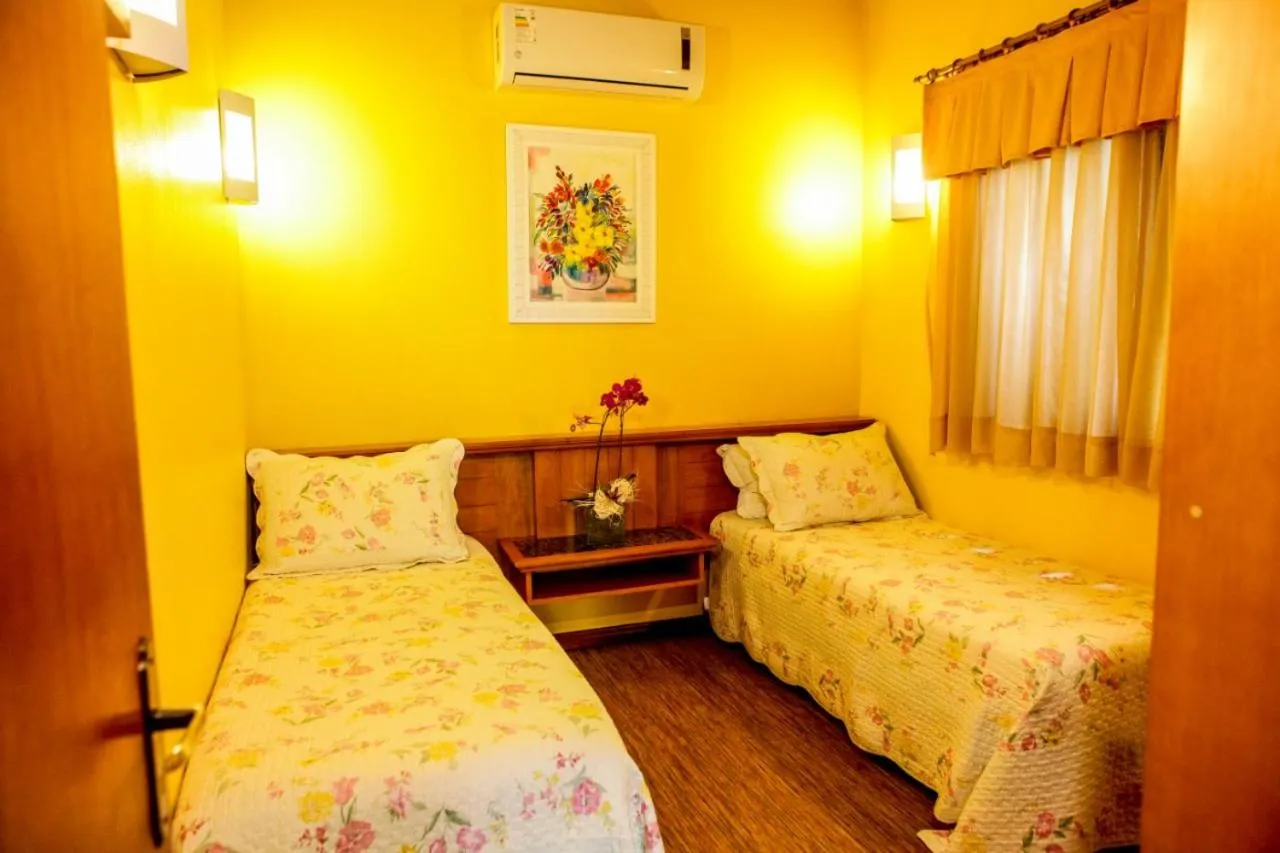 Bed in Pousada Das Papoulas