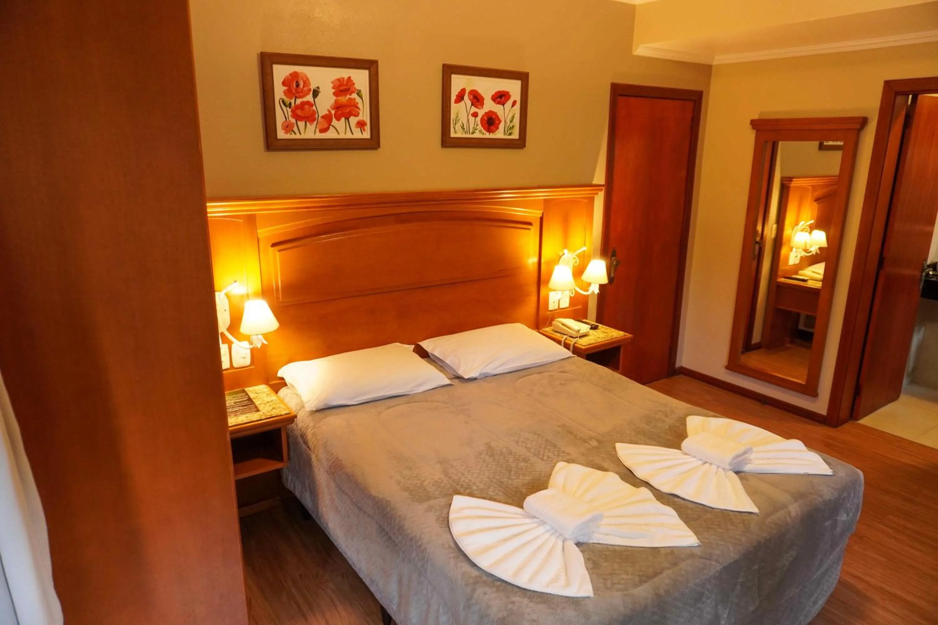 Bed in Pousada Das Papoulas