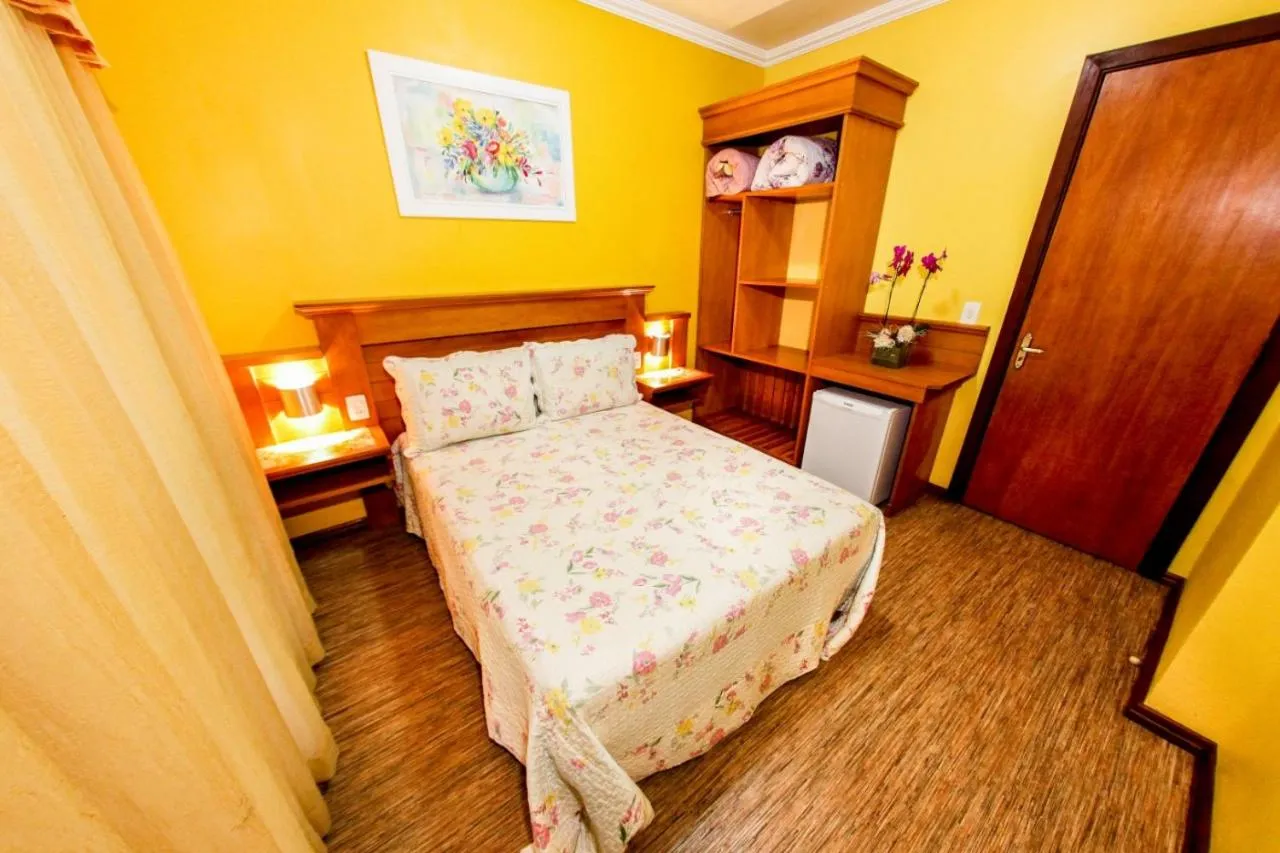 Bed in Pousada Das Papoulas