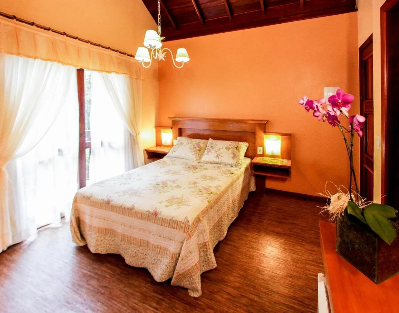 Bed in Pousada Das Papoulas