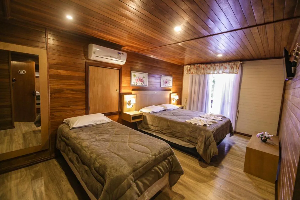 Bed in Pousada Das Papoulas