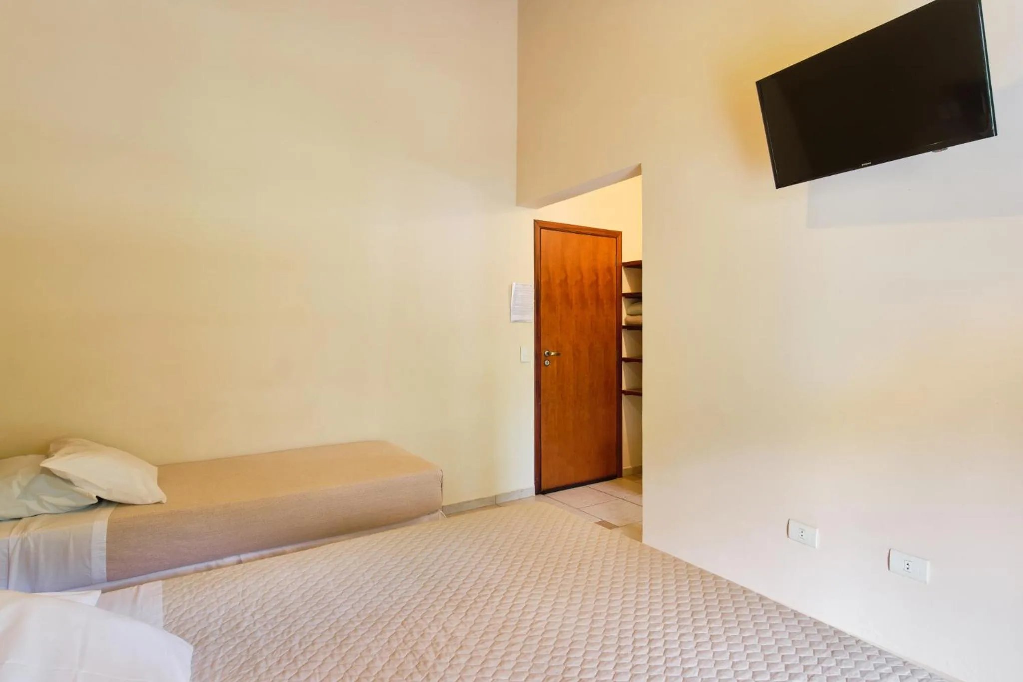 Bed in Pousada Recanto Montecarlo