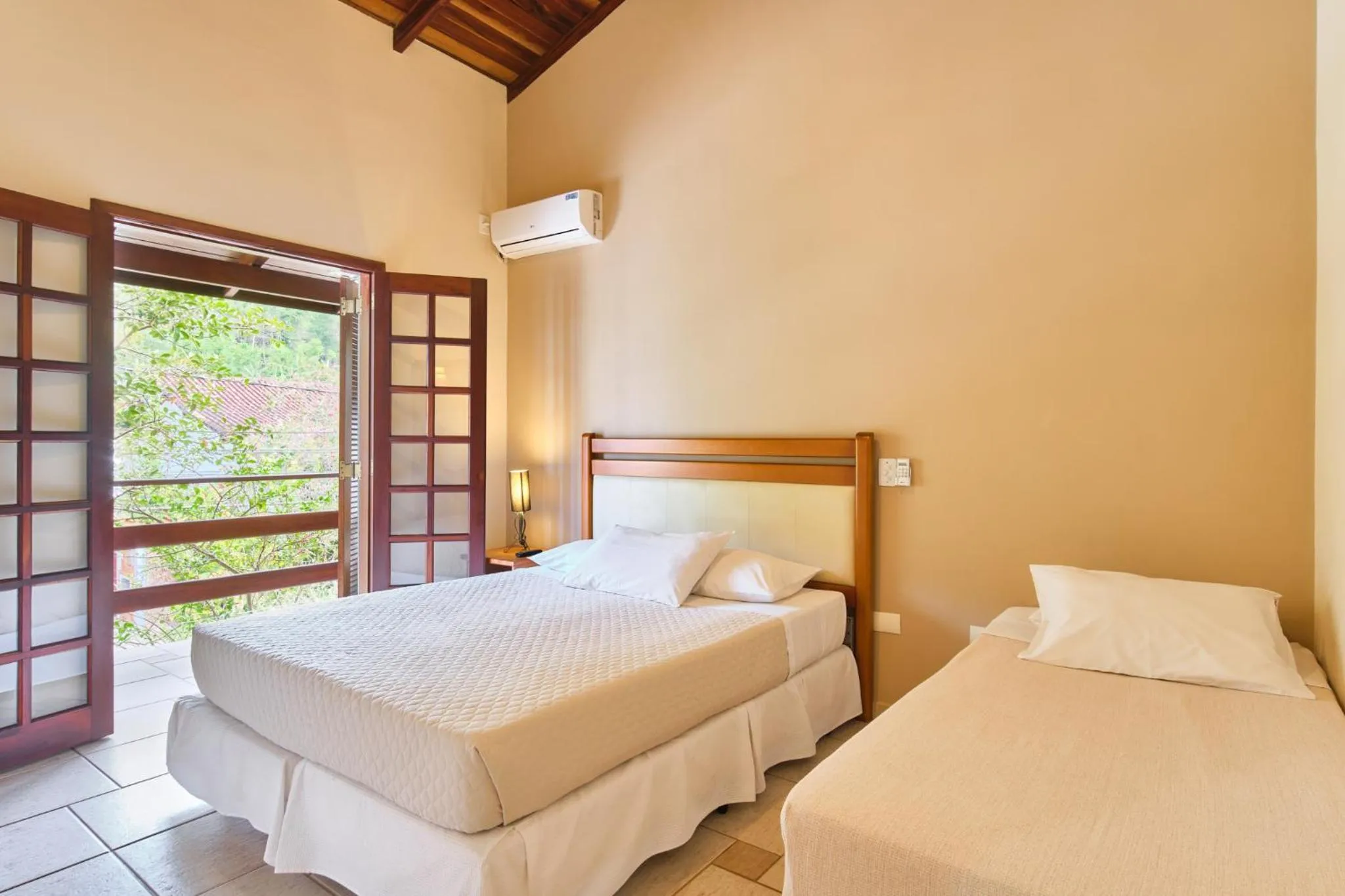 Bed in Pousada Recanto Montecarlo