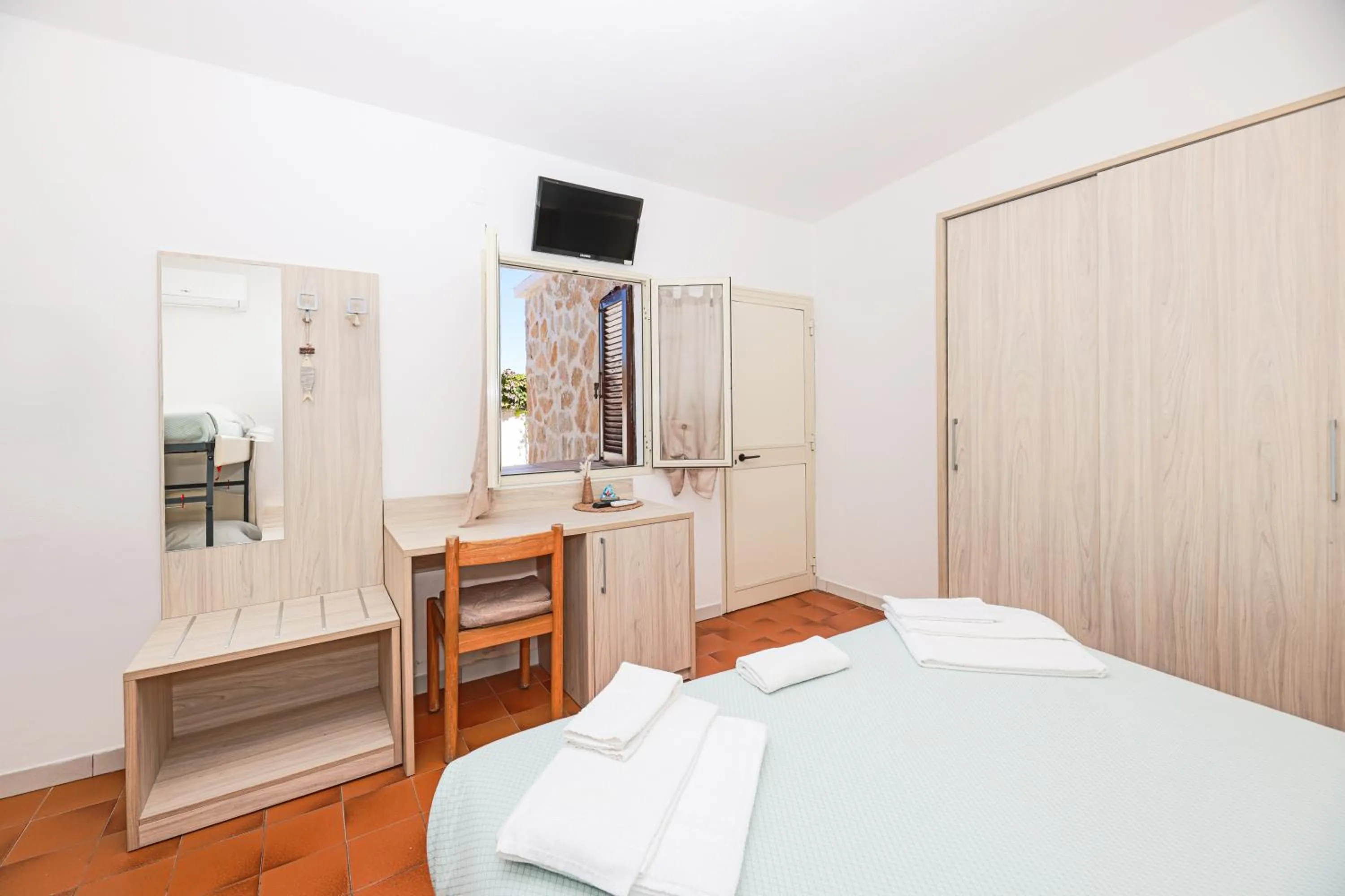 Bed in Hotel Le Ghiaie