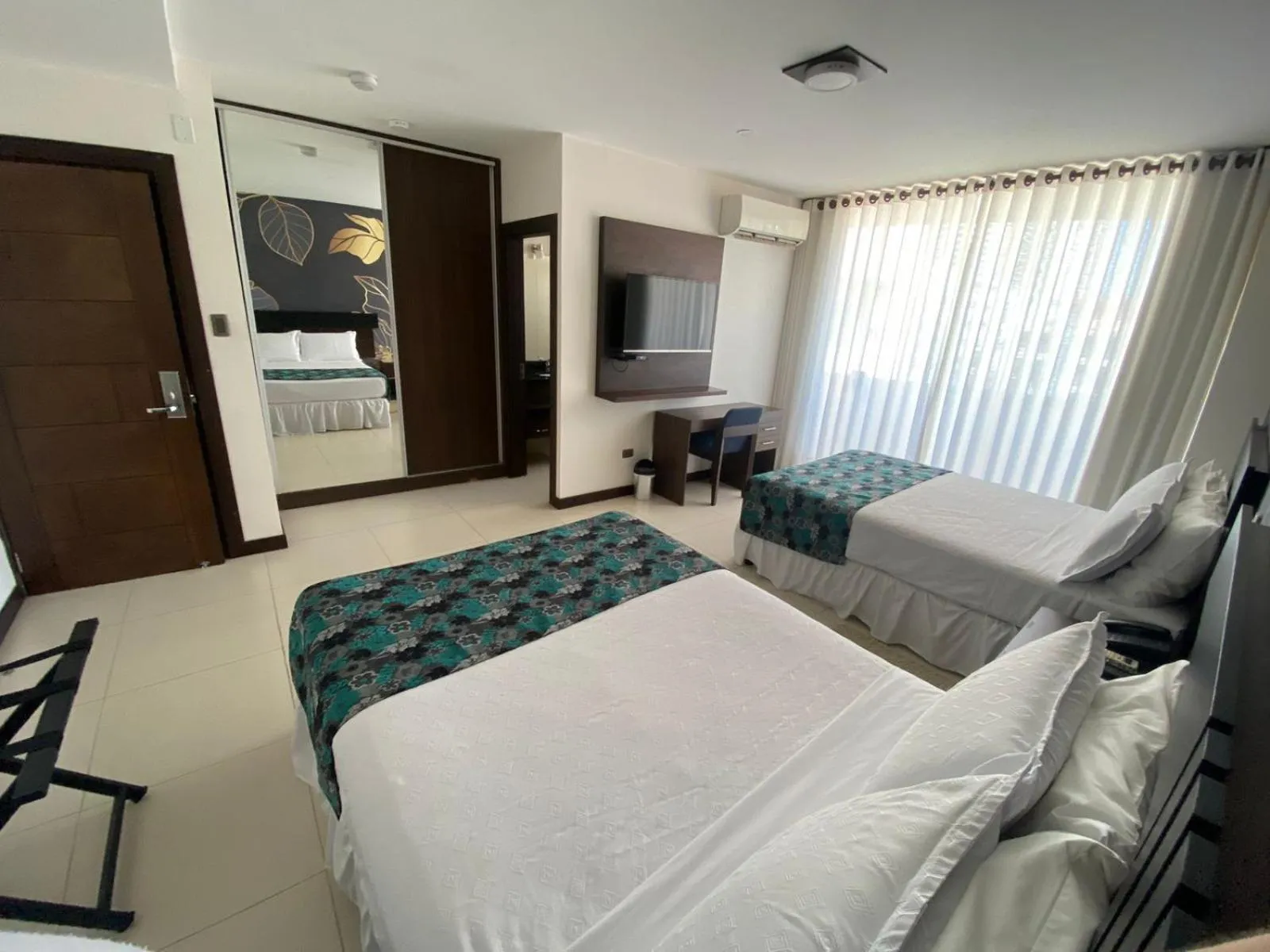 Bed in Mai Suites Apart Hotel