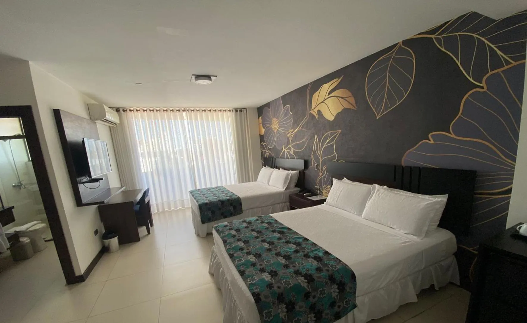 Bed in Mai Suites Apart Hotel