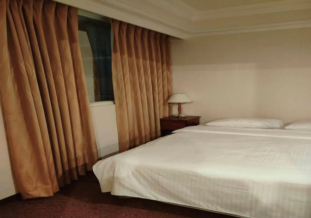 Bed in Champion Hotel