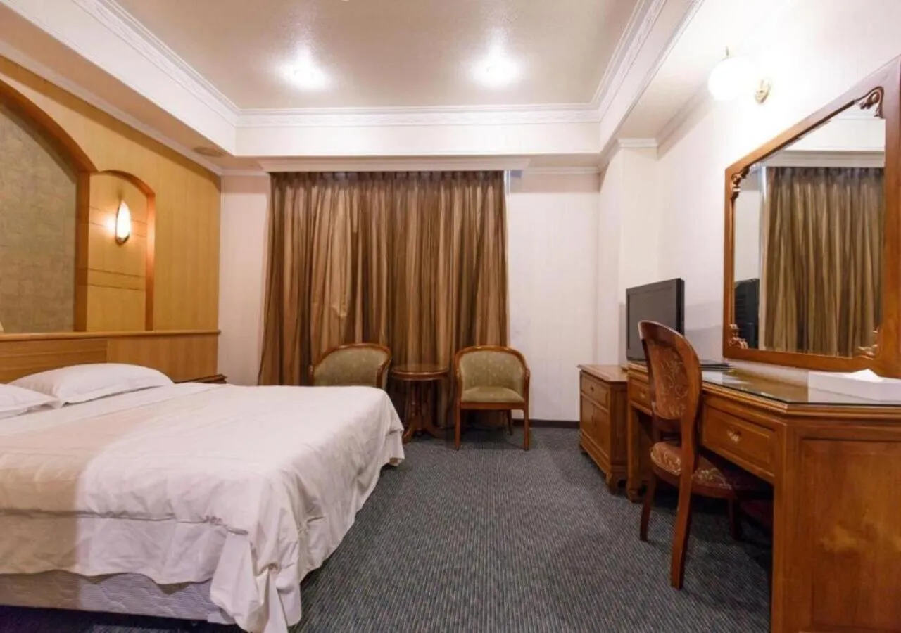 Bed in Champion Hotel