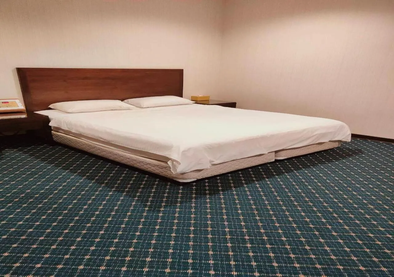 Bed in Champion Hotel