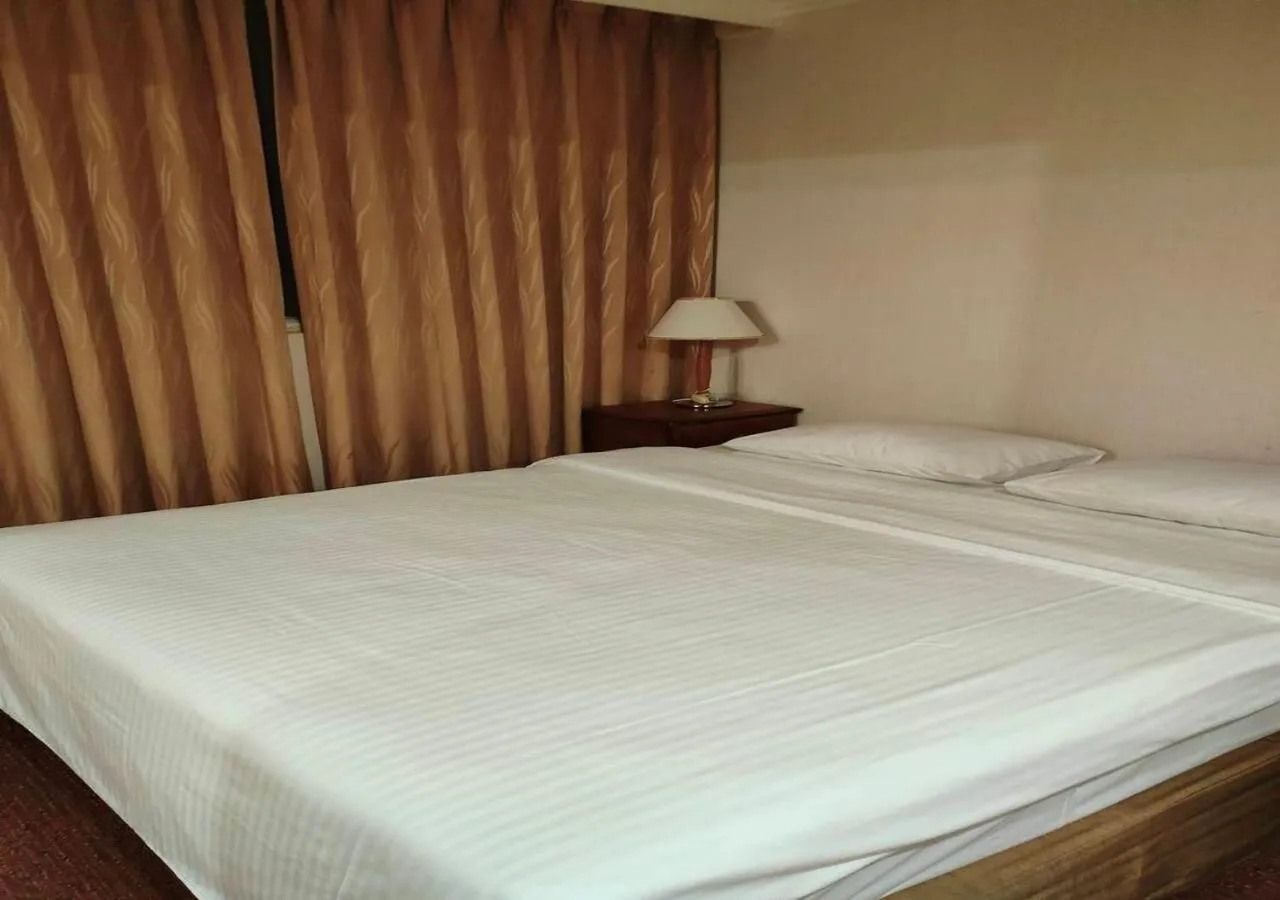 Bed in Champion Hotel