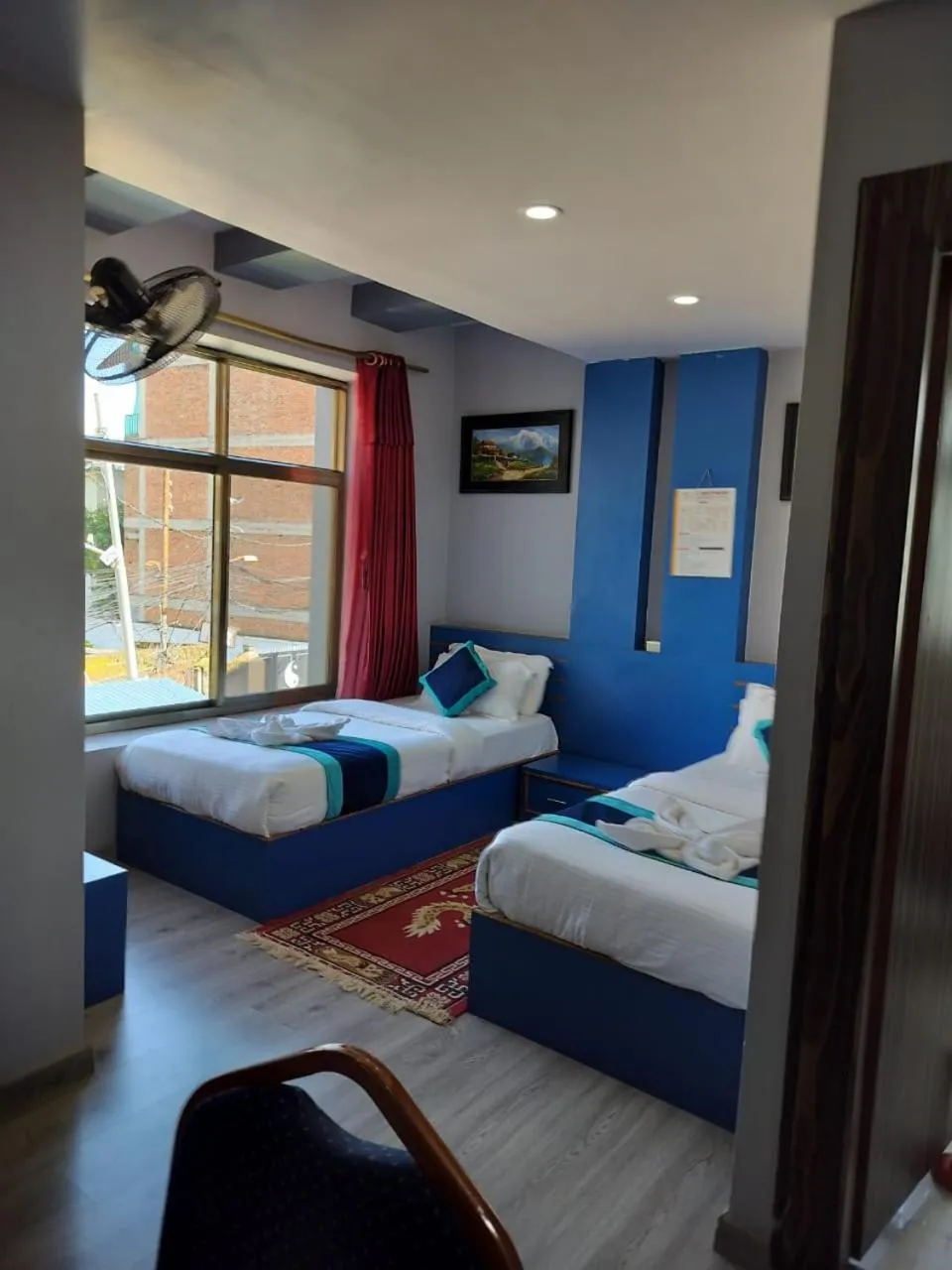 Bed in Three Brothers Apartment and Hotel