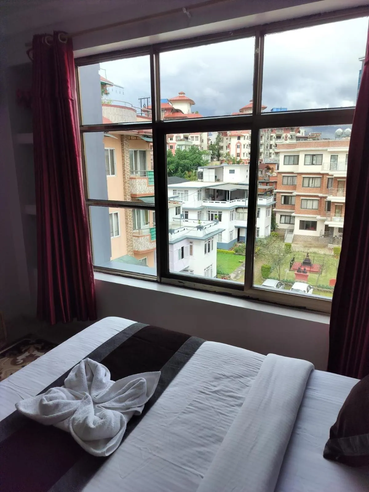 Bed in Three Brothers Apartment and Hotel