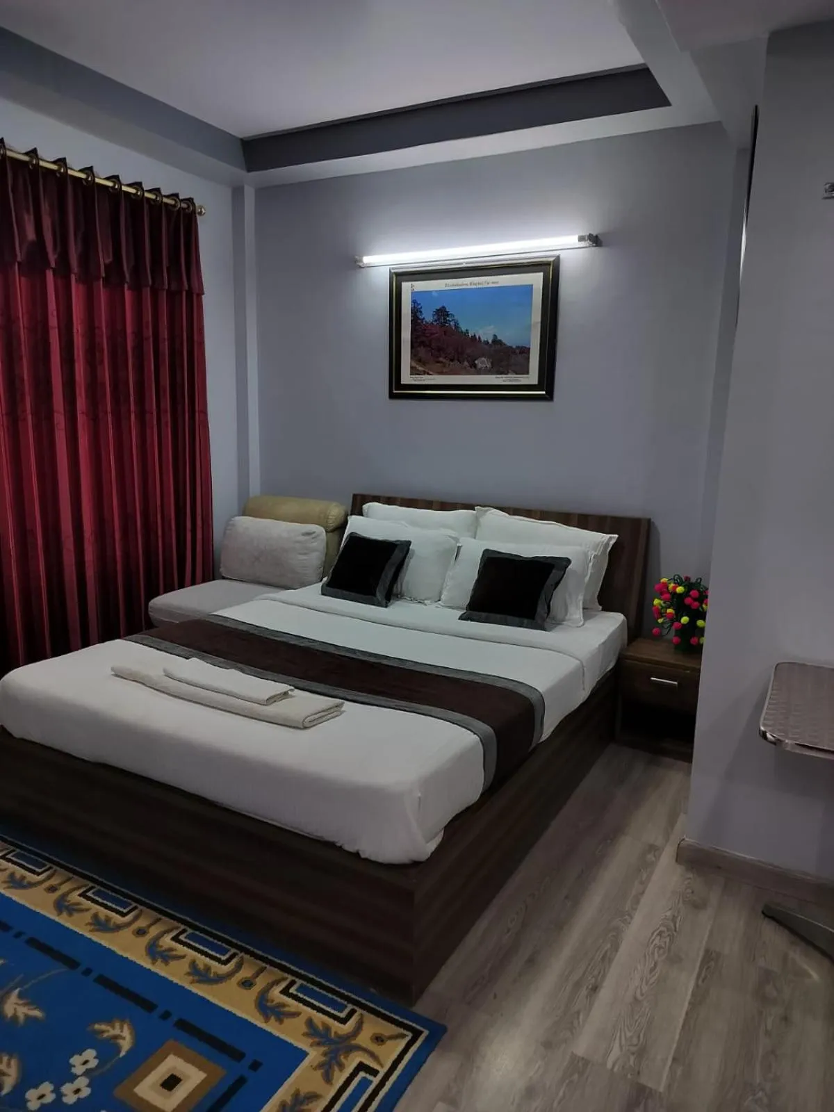 Bed in Three Brothers Apartment and Hotel